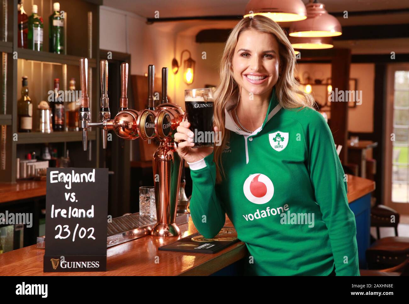 EDITORIAL USE ONLY Irish rugby supporter Vogue Williams enjoys a pint in Jodie Kidd???s gastropub, The Half Moon in Kirdford, to launch a VIP experience held by GUINNESS for Irish rugby fans