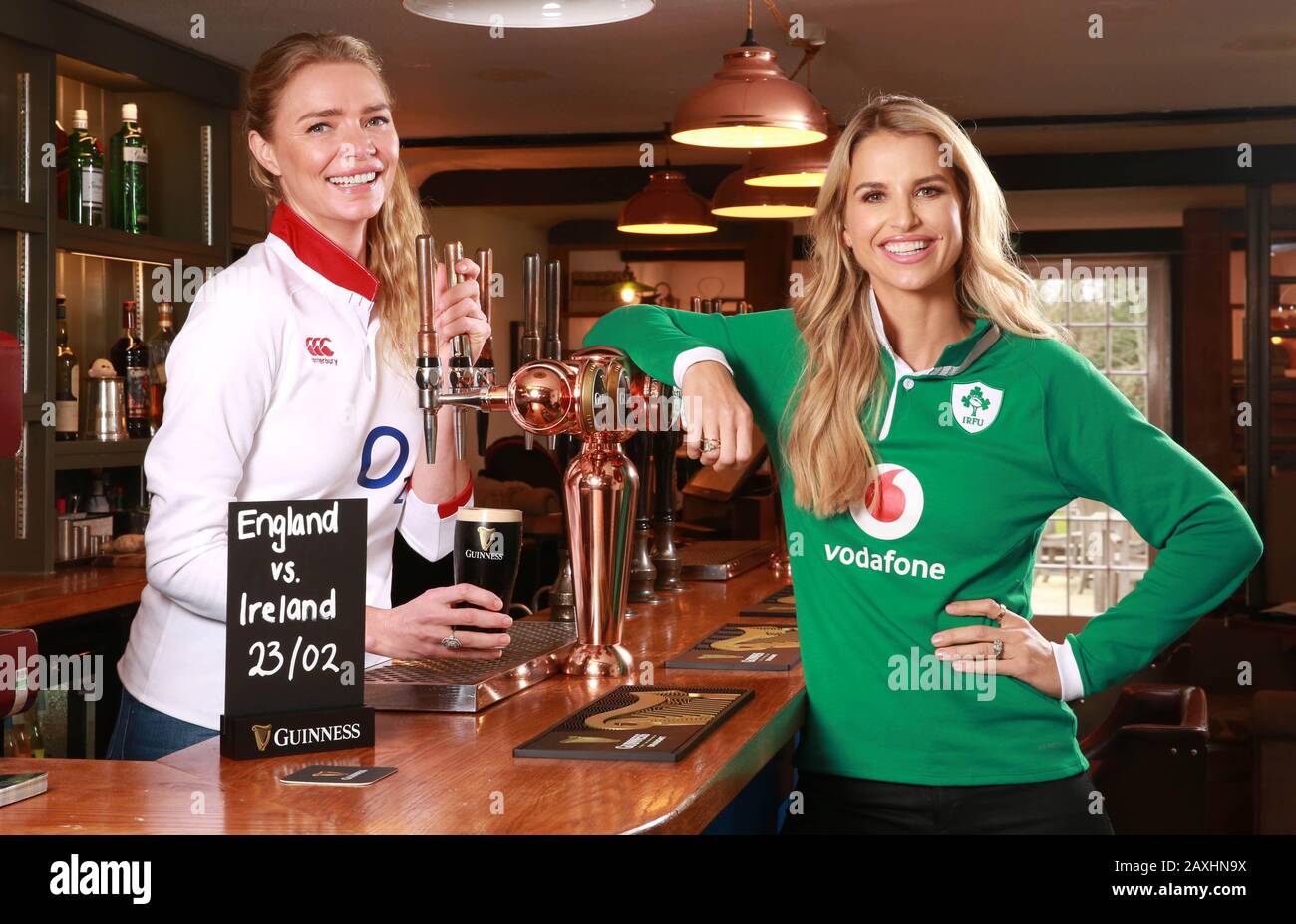 EDITORIAL USE ONLY (Left to right) England Rugby fan Jodie Kidd and Ireland supporter Vogue Williams enjoy a pint in Jodie???s gastropub, The Half Moon in Kirdford, to launch a VIP experience