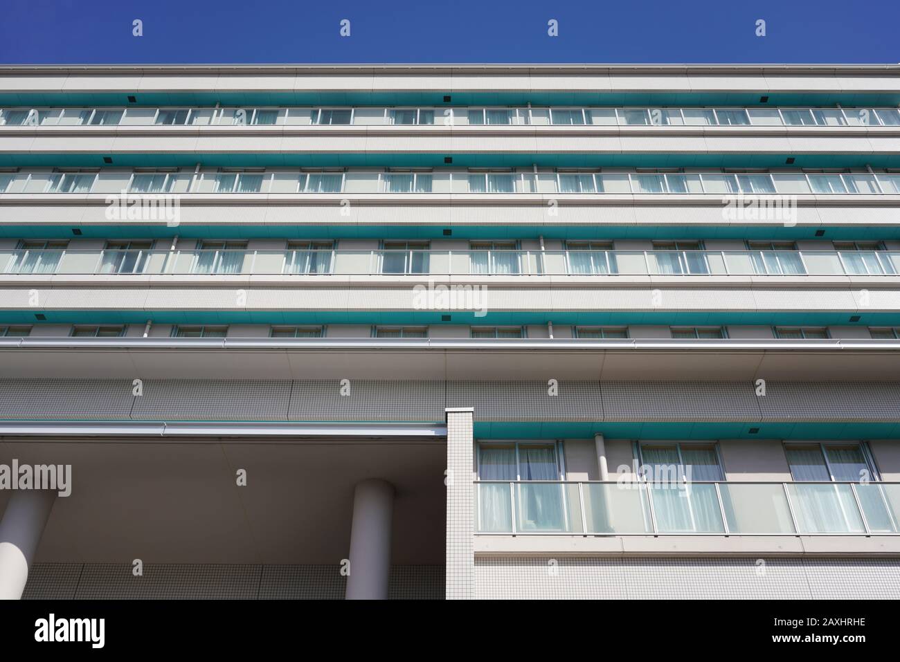 Modern white hospital building with sky in Japan Stock Photo Alamy