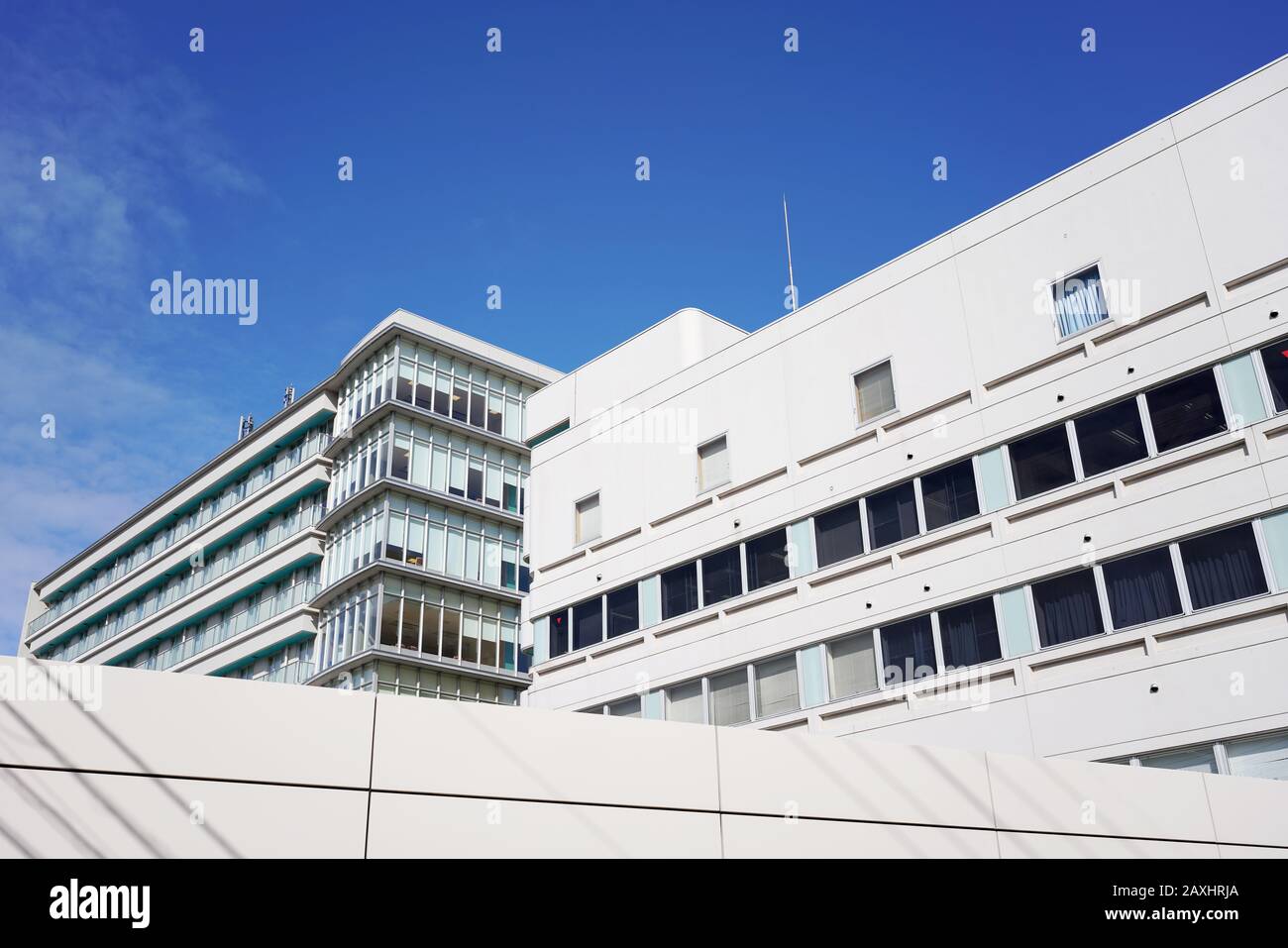 Modern white hospital building with sky in Japan Stock Photo Alamy