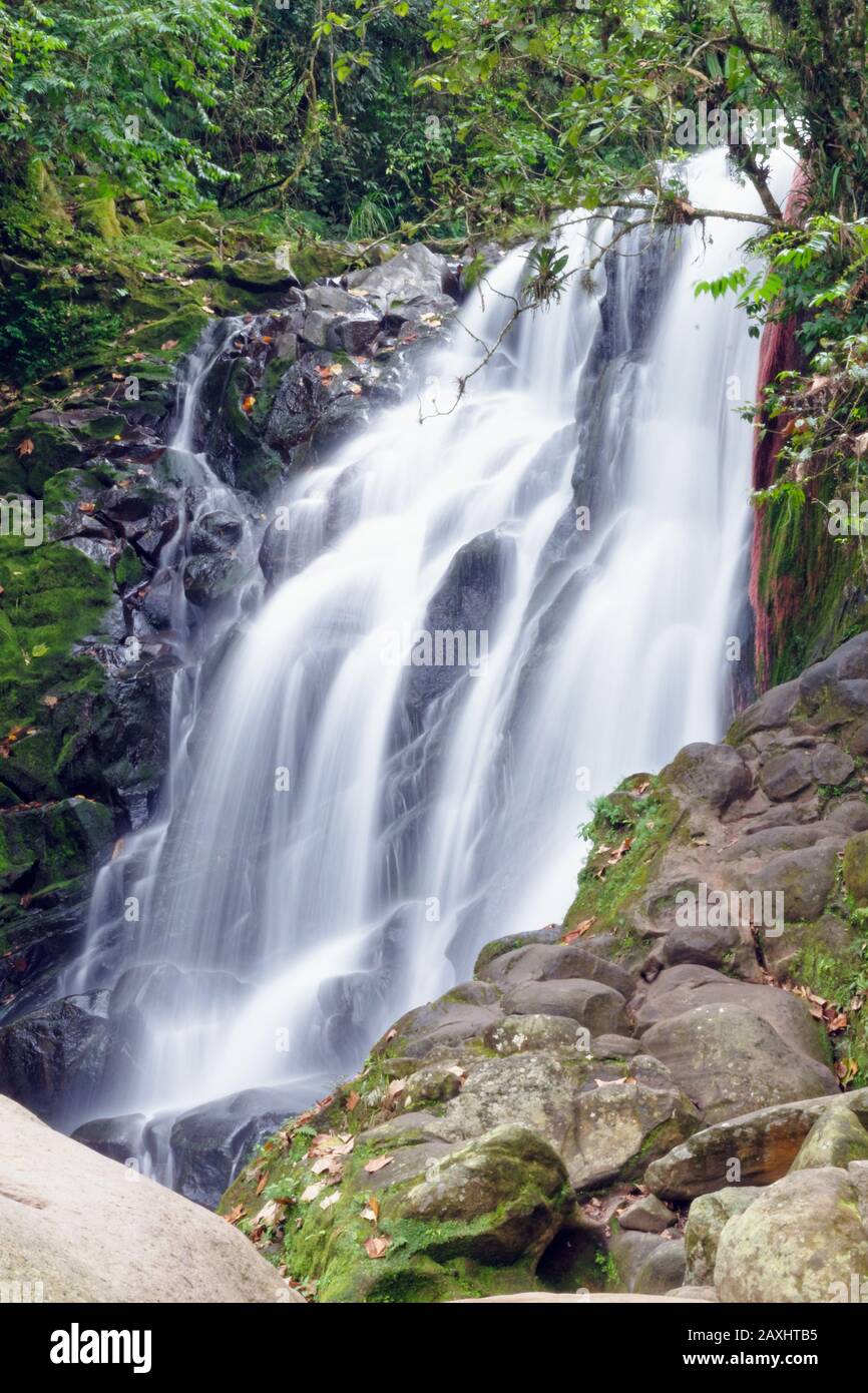 Vertical shot of a waterfall during daytime Stock Photo - Alamy