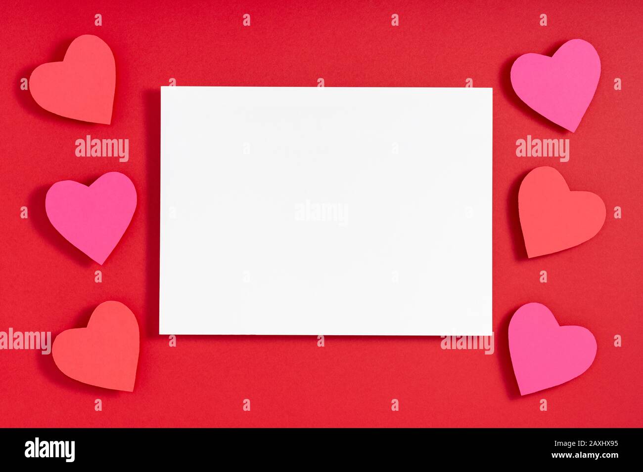 Valentine hearts with shadow, blank sheet of paper, template for design, greeting  card on red surface. Flat lay, top view, copy space, mock up Stock Photo -  Alamy