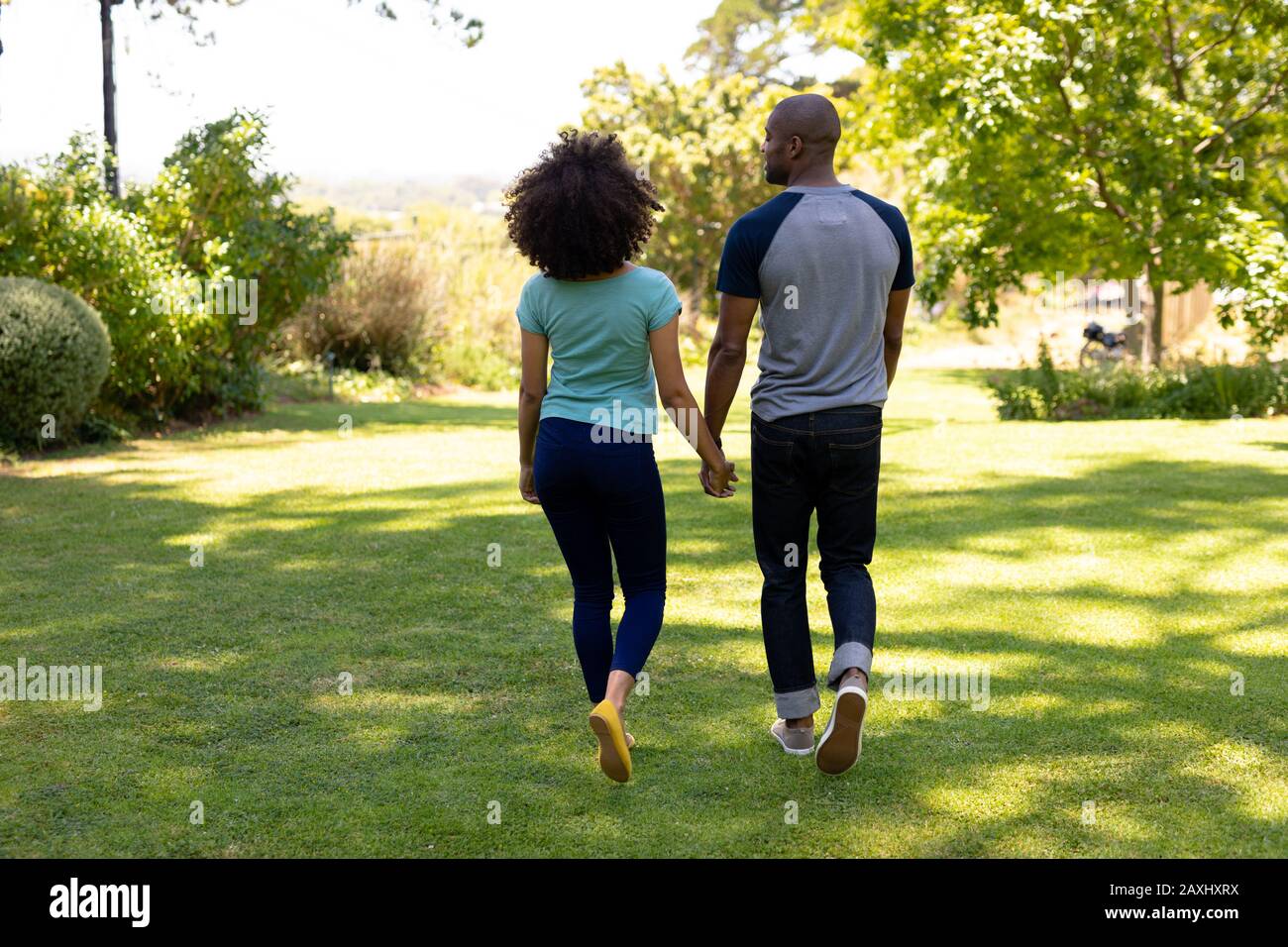 Young couple walking hand in hand hi-res stock photography and images ...