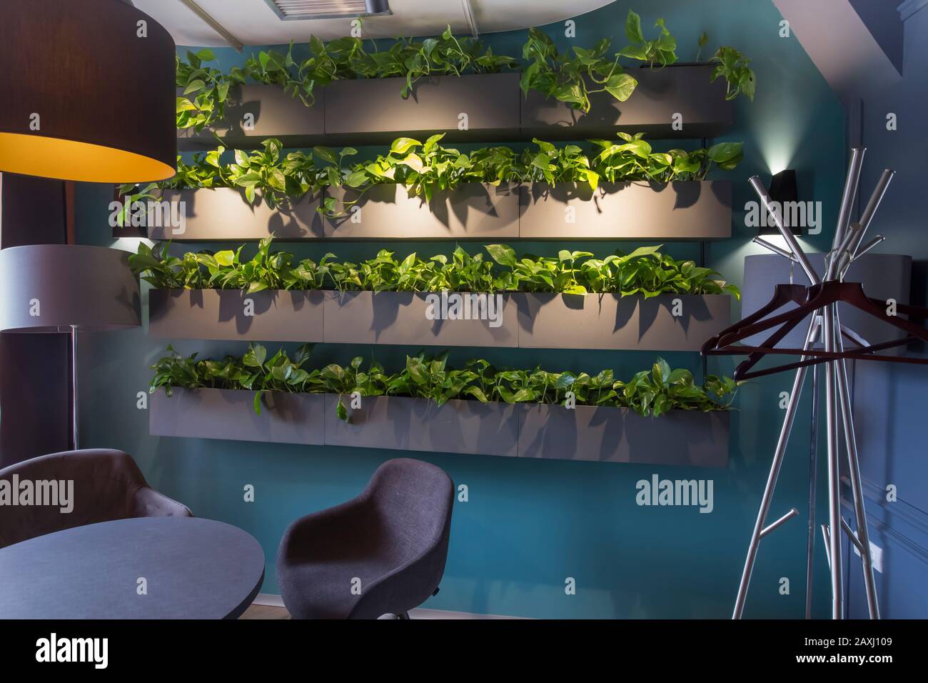 Eco restaurant interior with green artificial plants on wall Stock ...