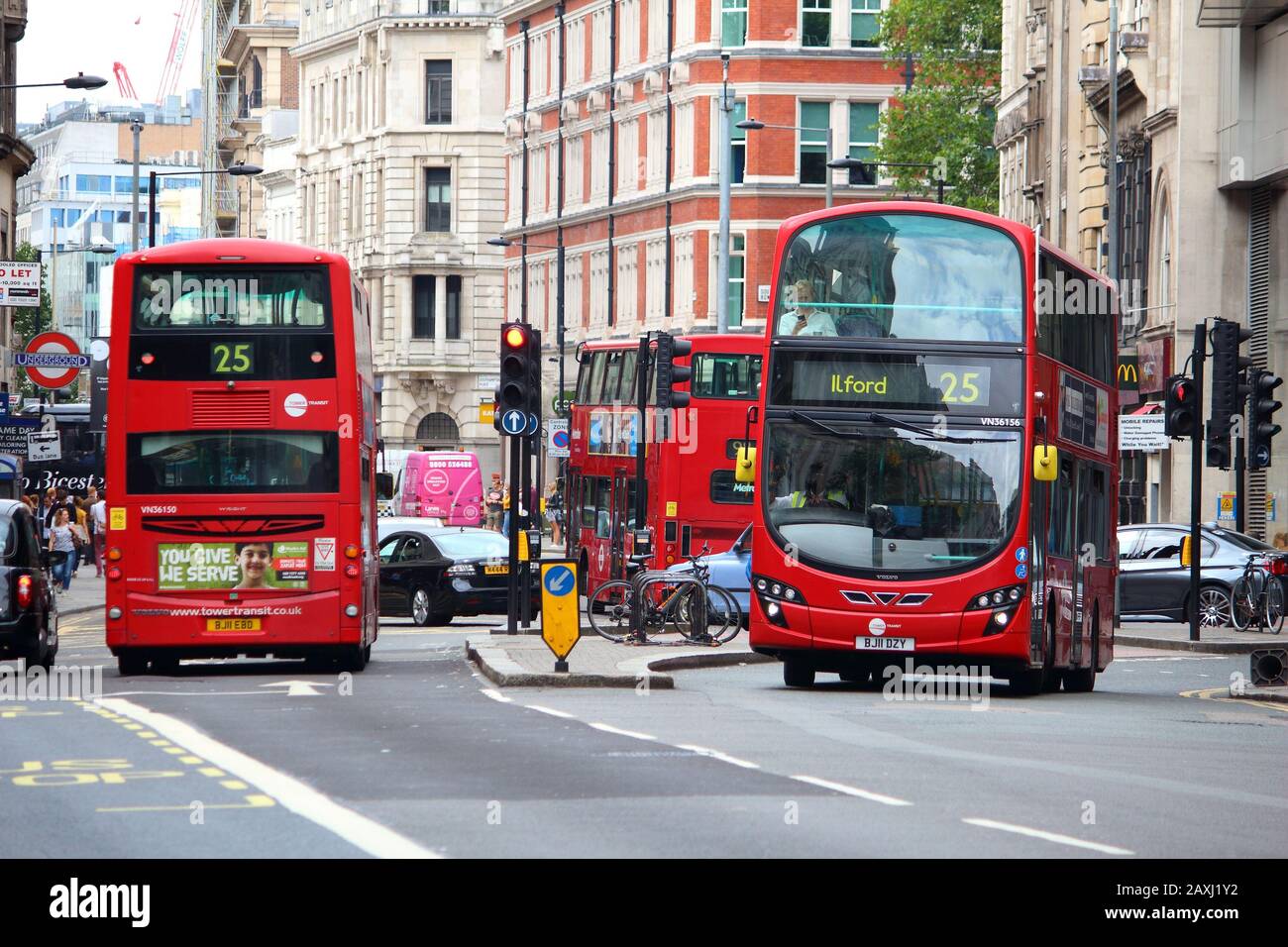 LONDON, UK - JULY 9, 2016: People ride city buses in Holborn, London. Transport for London (TFL) operates 8,000 buses on 673 routes. Stock Photo