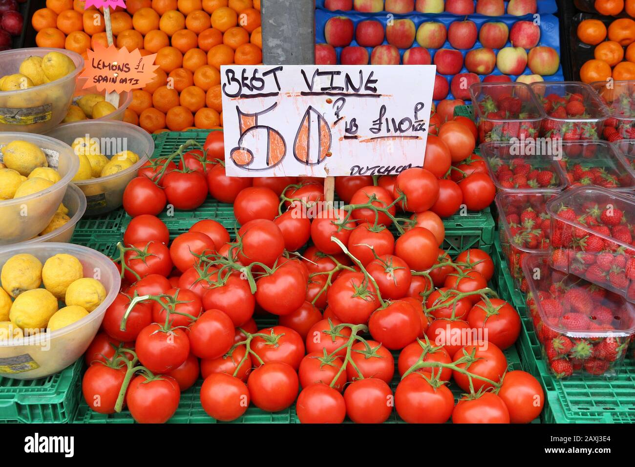 Vine tomatoes vegetable shopping at a market place in Leeds, UK Stock