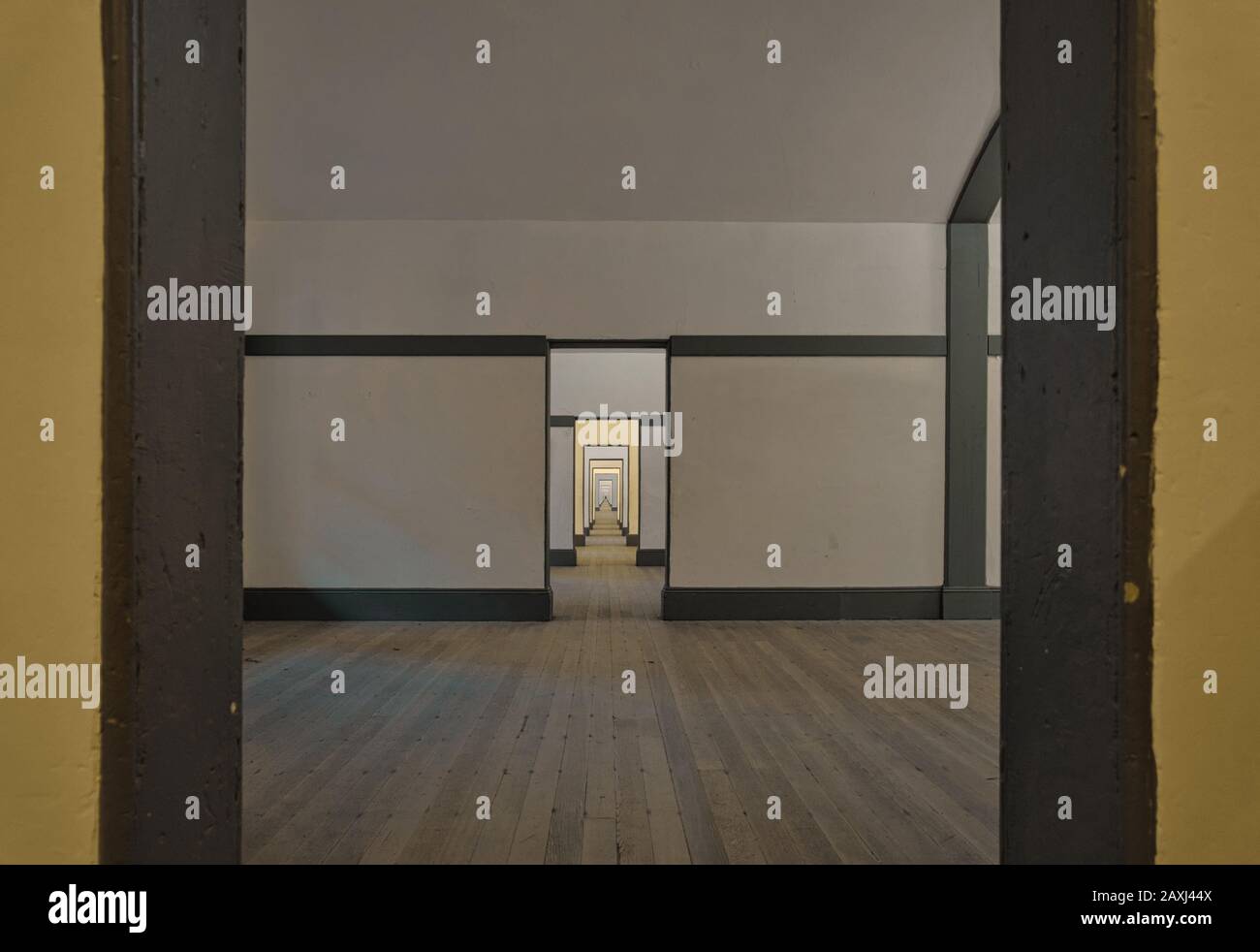 Seemingly endlessly arranged rooms with old wooden floors Stock Photo