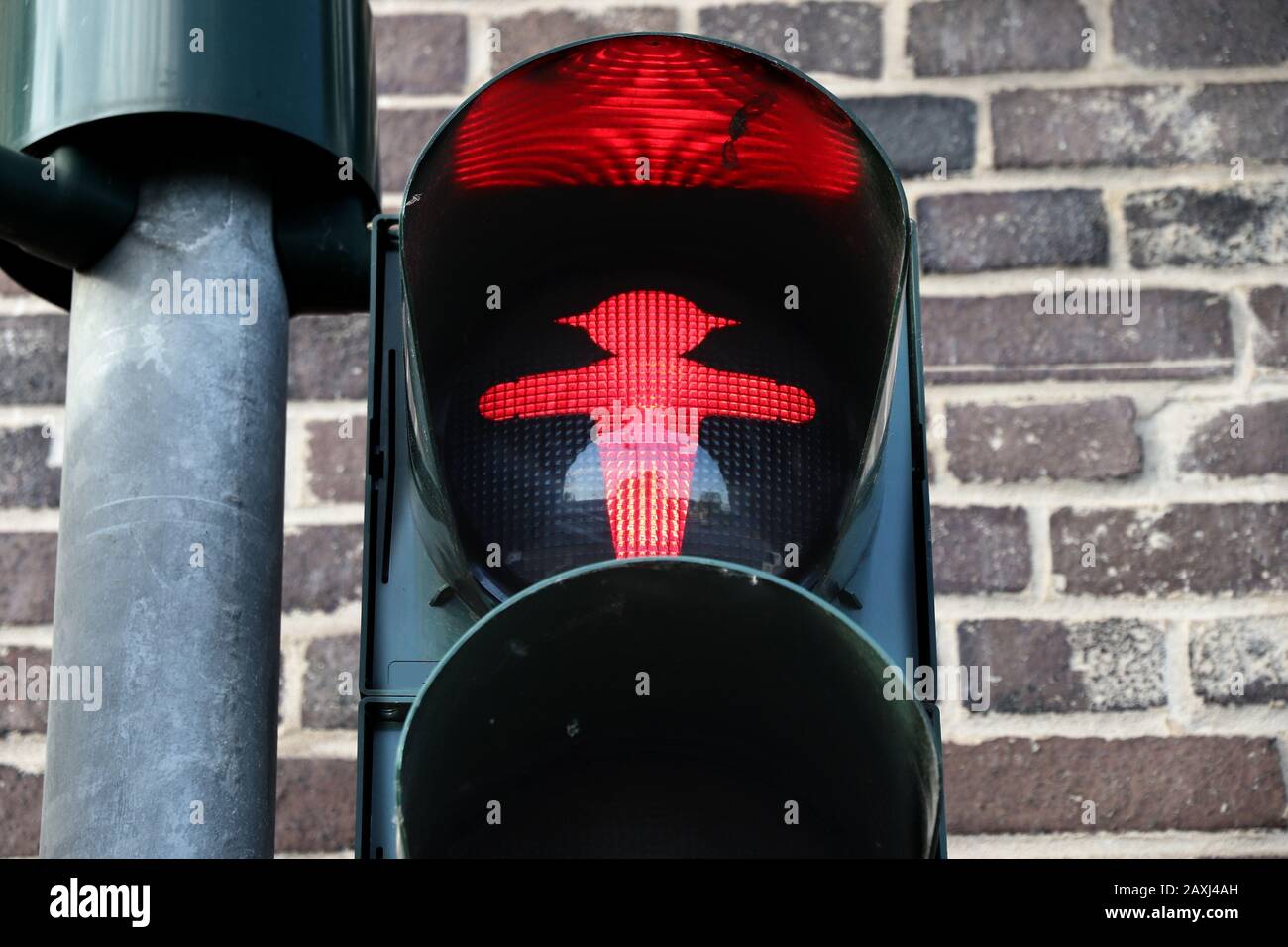 German traffic light - pedestrian red light. Typical pedestrian symbol in Germany. Stock Photo