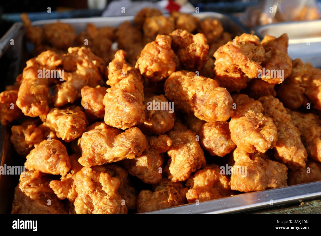 Photo of deep fried chicken neck with breading sold at a street food
