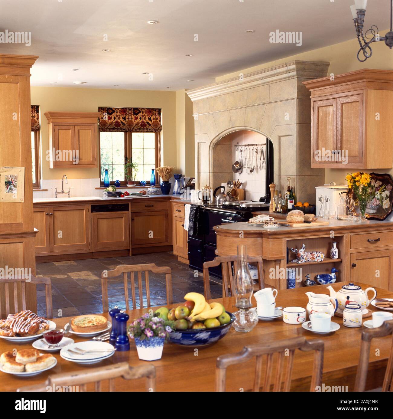 Large kitchen with pine units and aga Stock Photo Alamy