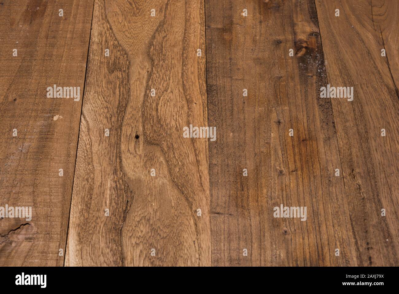 Brown wooden table with perspective white wall in the background Stock Photo