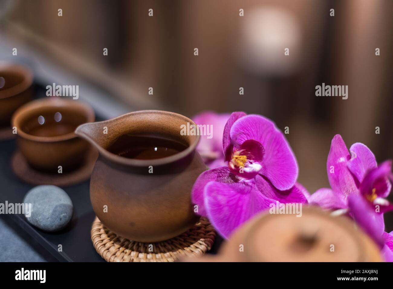 Traditional Chinese tea Set up with orchid and pebbles Stock Photo Alamy