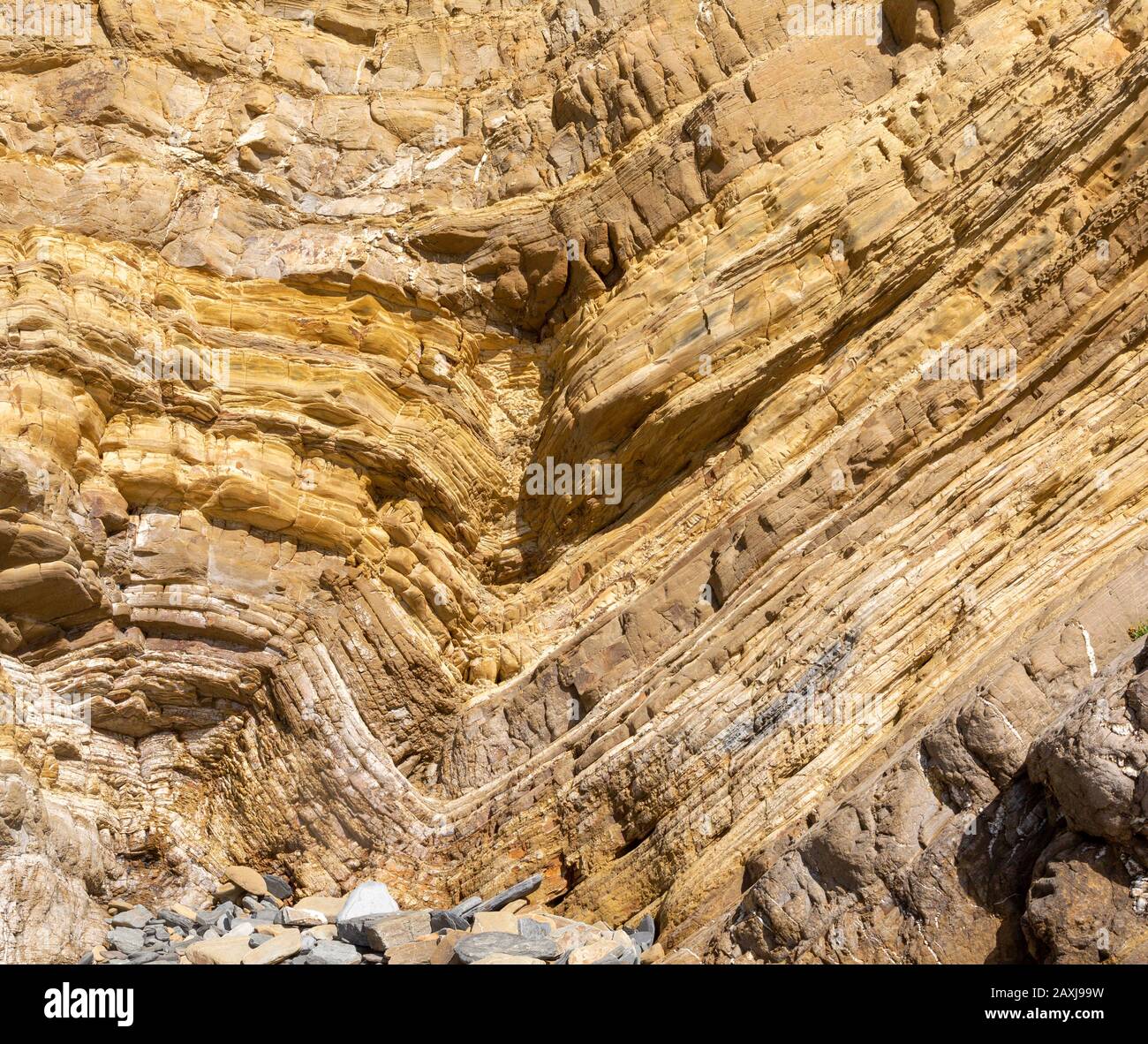 Strata of sandstone sedimentary rock  coastal cliff layers folded geological syncline structure, Zambujeiro do Mar, Alentejo Littoral, Portugal Stock Photo