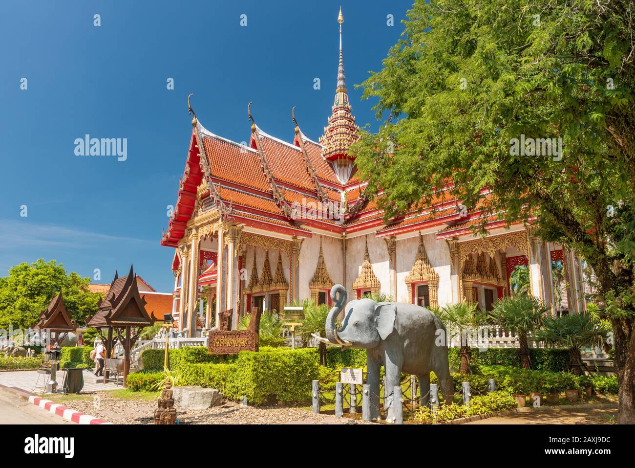 Wat Chalong,Phuket/Thailand-15December2019: view on a pagoda at the historical landmark and Buddhist temple with blue sky and sunny day Stock Photo