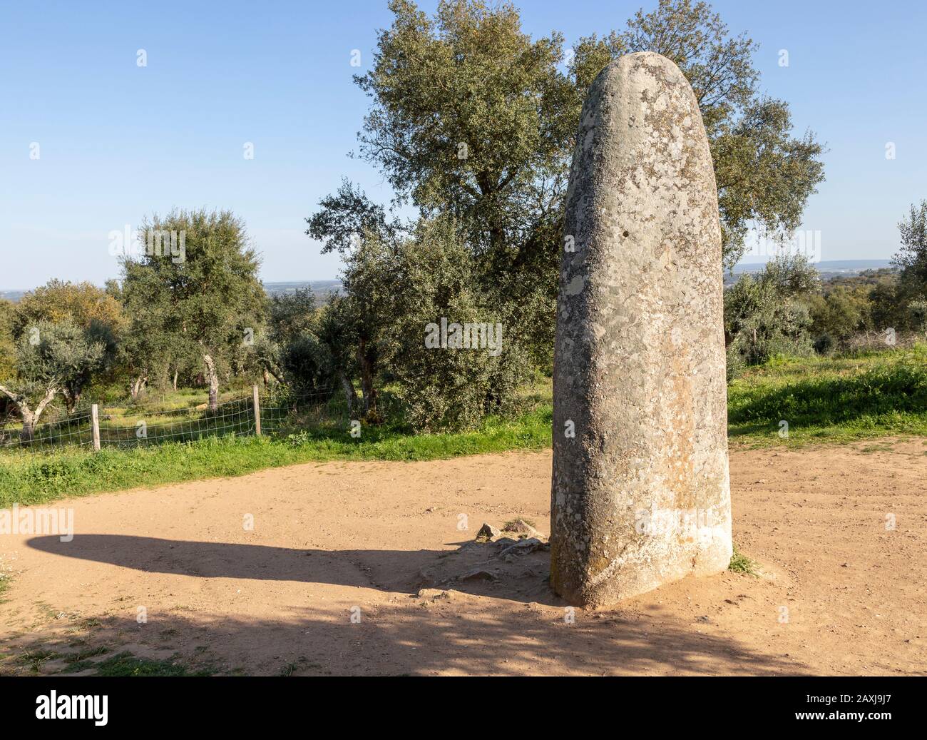 Neolithic standing stone 4 metres high called the Menir dos Almendres, near Evora, Alentejo, Portugal, Southern Europe Stock Photo