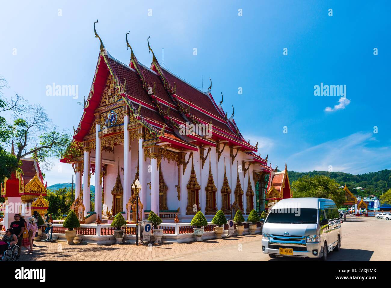 Wat Chalong,Phuket/Thailand-15December2019: view on a pagoda at the historical landmark and Buddhist temple with blue sky and sunny day Stock Photo