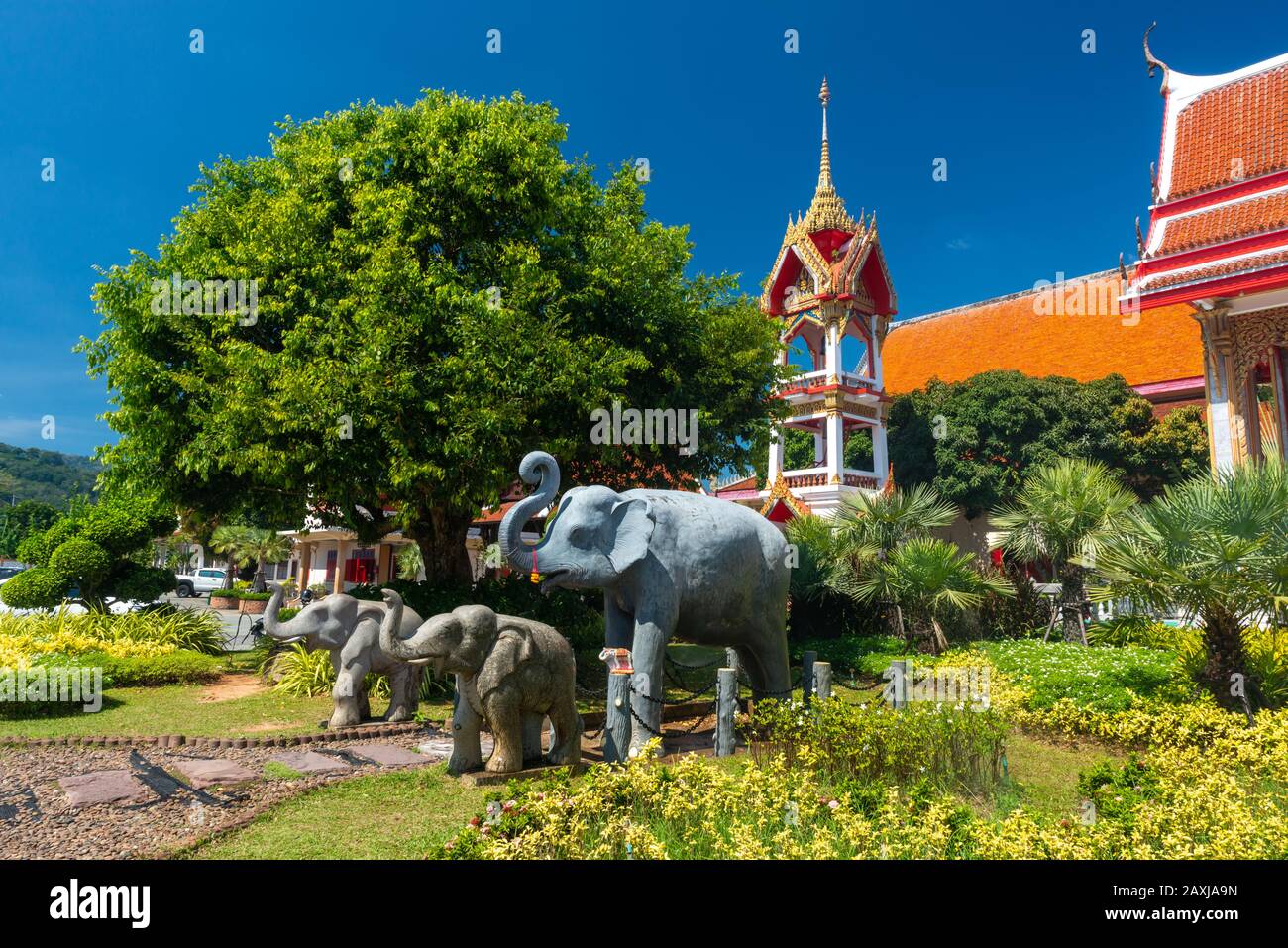 Wat Chalong,Phuket/Thailand-15December2019: view on a pagoda at the historical landmark and Buddhist temple with blue sky and sunny day, with elephant Stock Photo