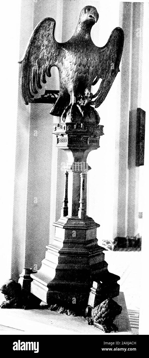 Dinanderie; a history and description of mediæval art work in copper, brass and bronze . Fig. 52.- -Lectern, S. Germain,Tirlemont. Ir-ATE XXX11LECTERN, s. MARTIX, HAL LECTERNS i6i book-desk is supported on the outstretched wings of a peHcanin its piety, standing on an orb which was once surrounded bybattlements, but these were knocked off and the lectern con-siderably damaged when Tirlemont was sacked by the Frenchin 1635. The lectern of Louvain Cathedral, which was con-sidered even more beautiful, was sold, with two fine coronas,about sixty years ago, and is now in the Church of S. MaryOscott Stock Photo