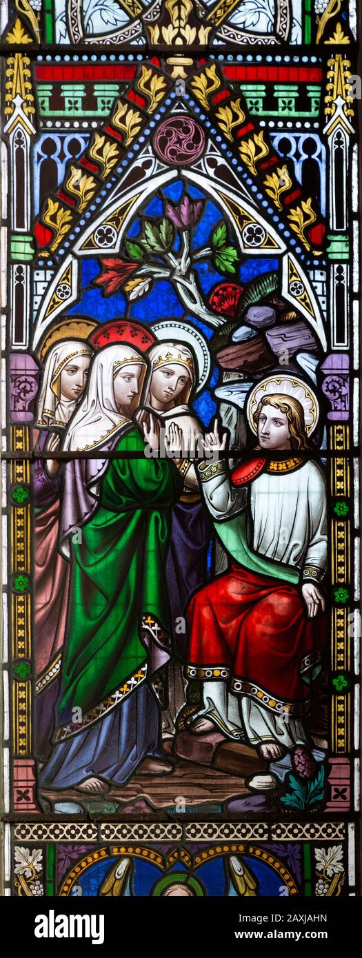 Victorian stained glass window three Marys at tomb of Jesus Christ circa 1858 by William Wailes (1808-1881), Urchfont church, Wiltshire, England UK Stock Photo