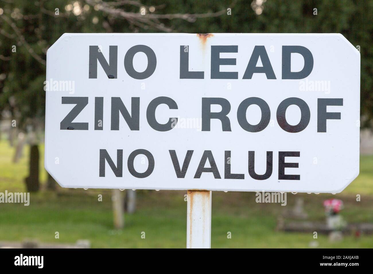 No Lead Zinc Roof No Value sign outside church to deter potential thieves who target churches for their lead roofs, Ellingham, Norfolk, England, UK Stock Photo