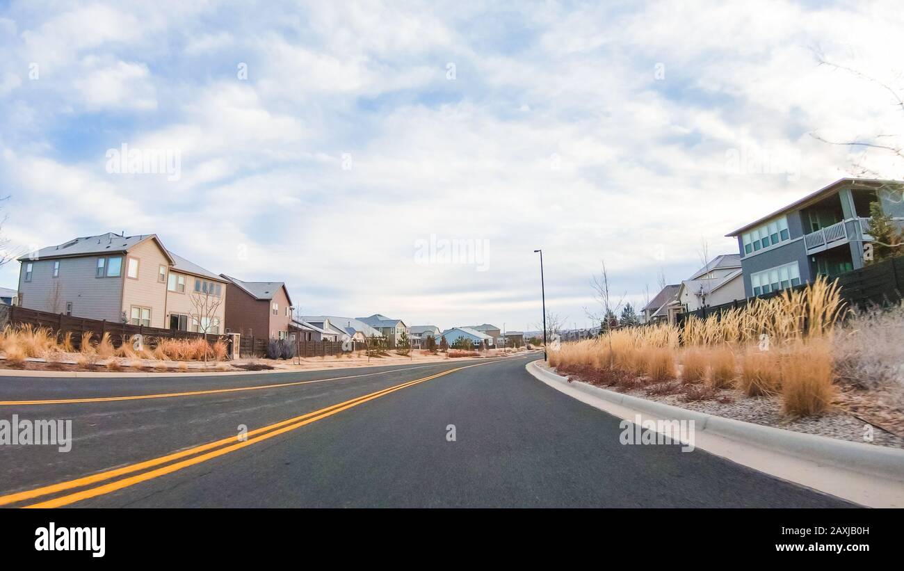 Driving through new residential neighborhood in suburbia Stock Photo