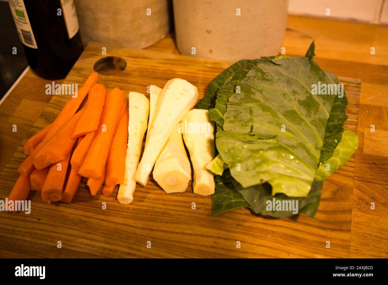 Vegetables prepared cut on chopping board, carrots, parsnips, cabbage Stock Photo