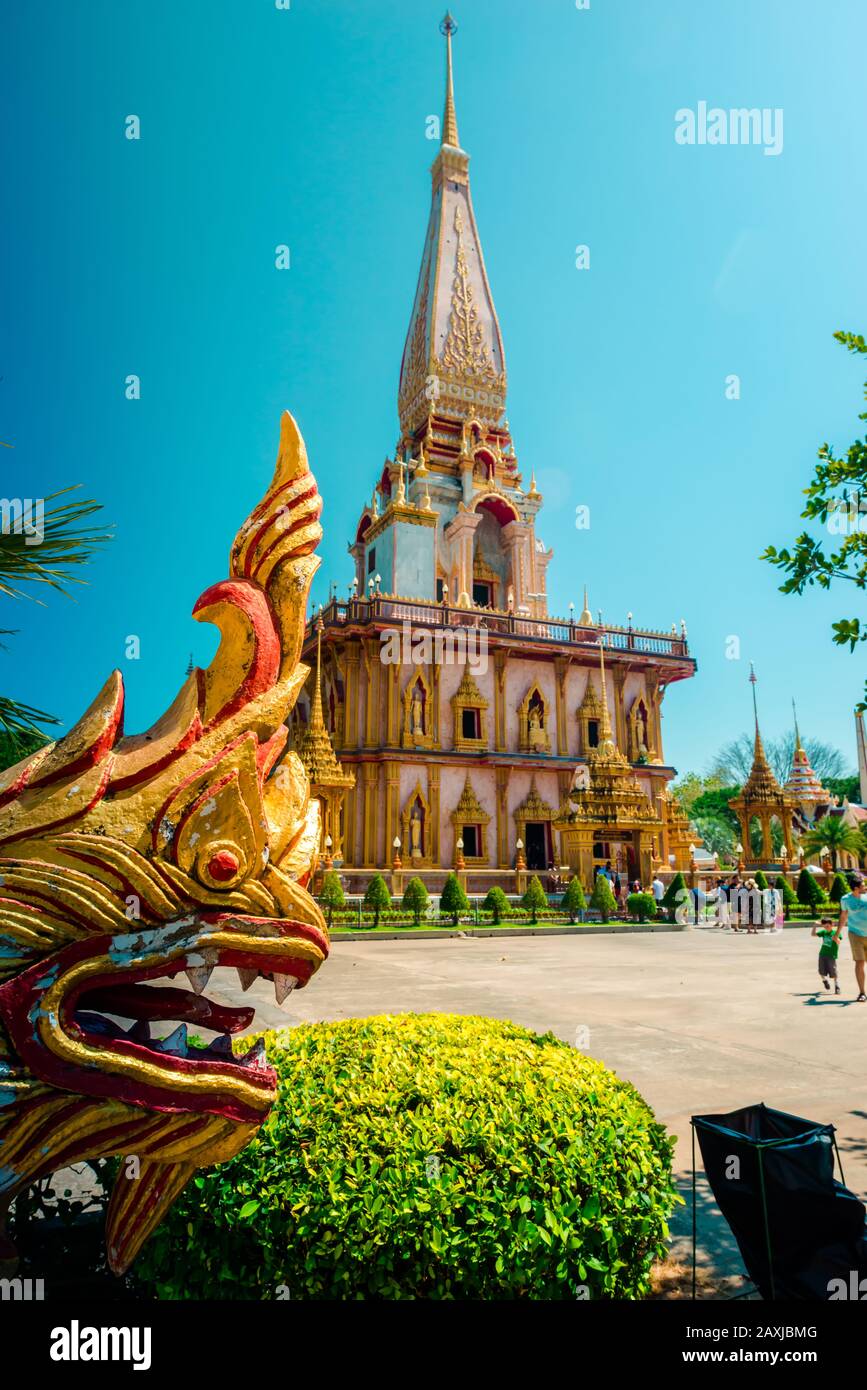 Wat Chalong,Phuket/Thailand-15December2019: view on a pagoda at the historical landmark and Buddhist temple with blue sky and sunny day Stock Photo