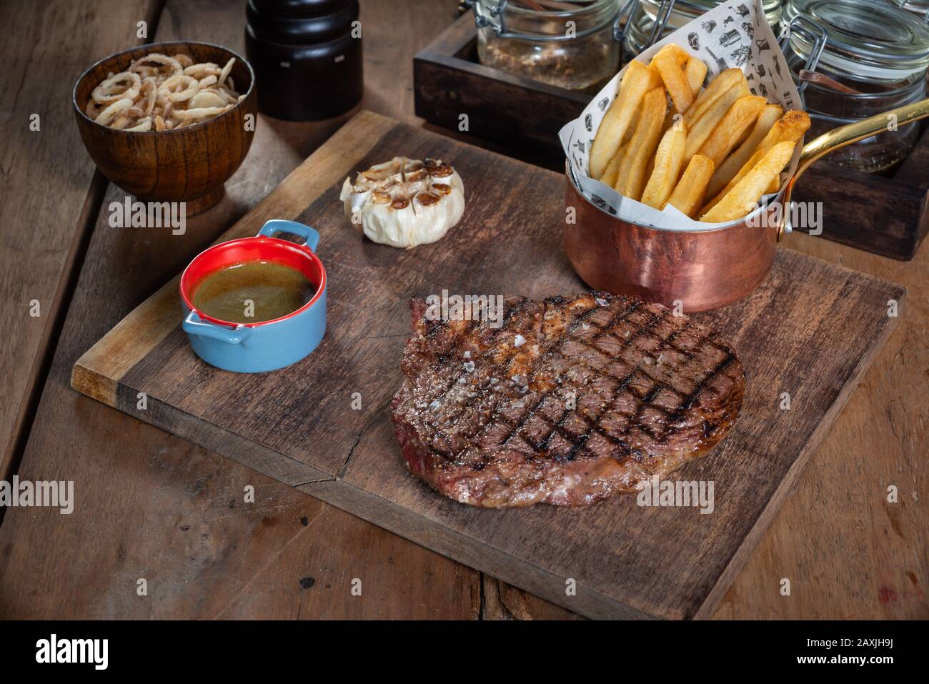 Steak on rustic cutting board Stock Photo