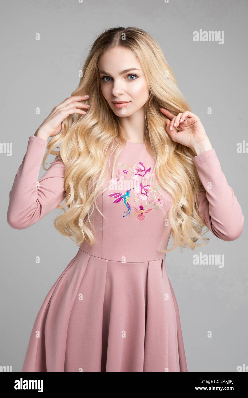 Stock portrait of gorgeous blonde in pink dress Stock Photo - Alamy