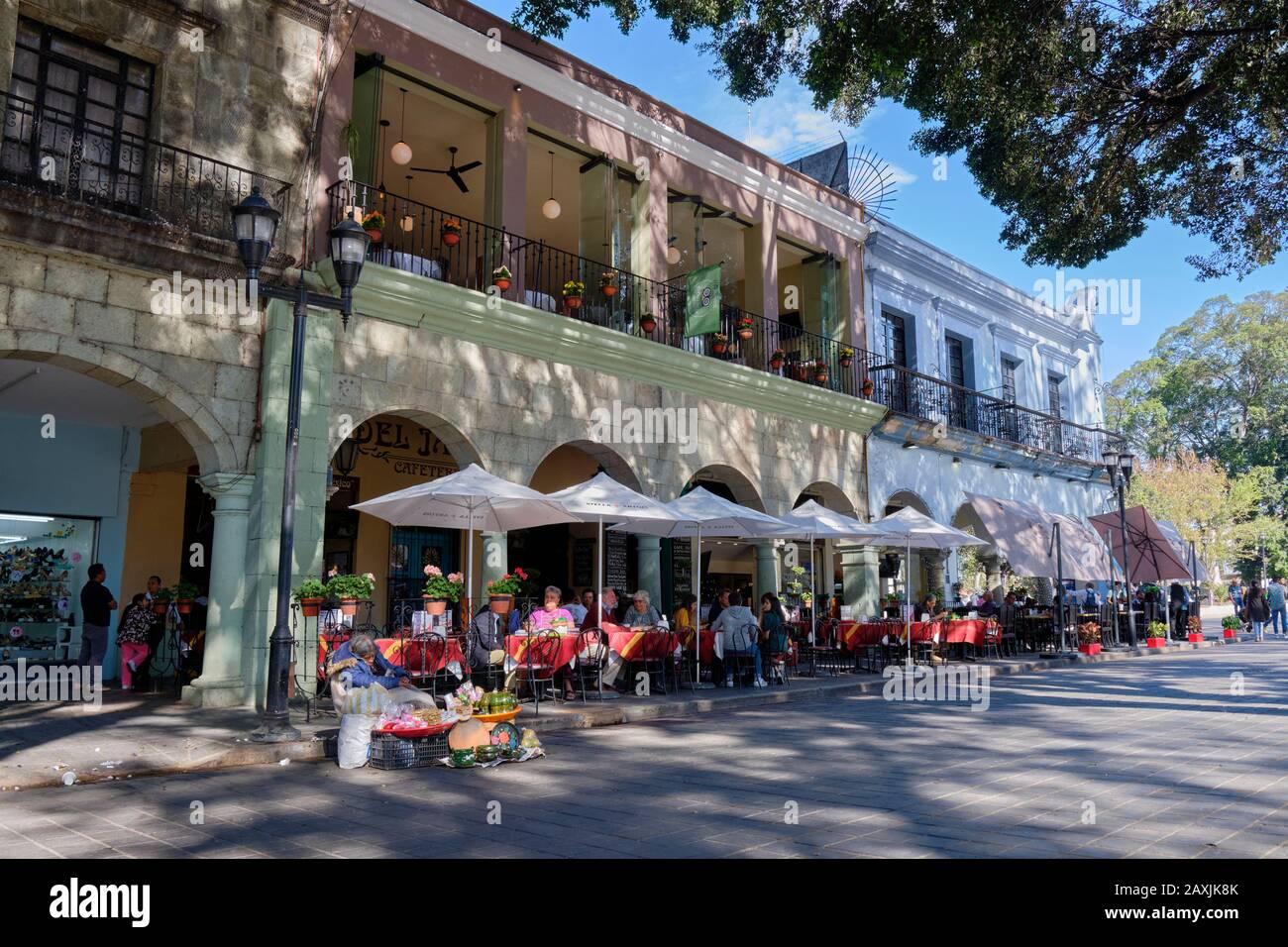 Outdoors cafe and patio restaurant, in colonial architecture, on the centre square of Oaxaca, Mexico. Stock Photo
