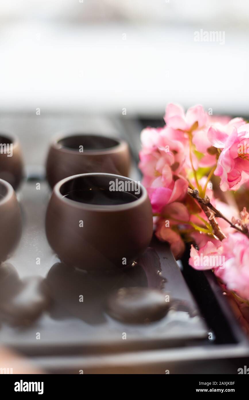 Traditional Chinese tea Set up with flowers Stock Photo