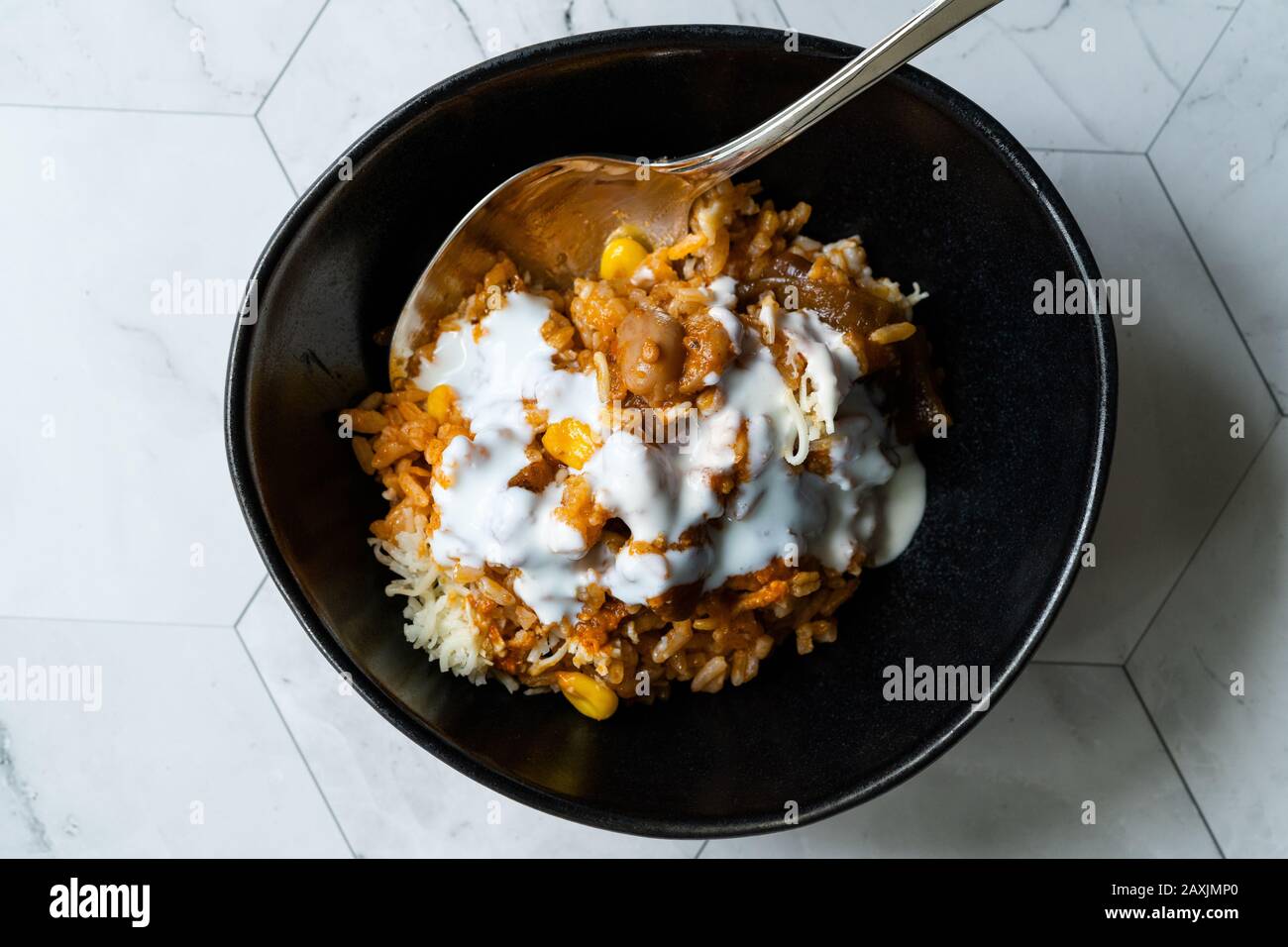 Mexican Rice with Kidney Bean, Sour Cream, Grated Mozzarella Cheese and