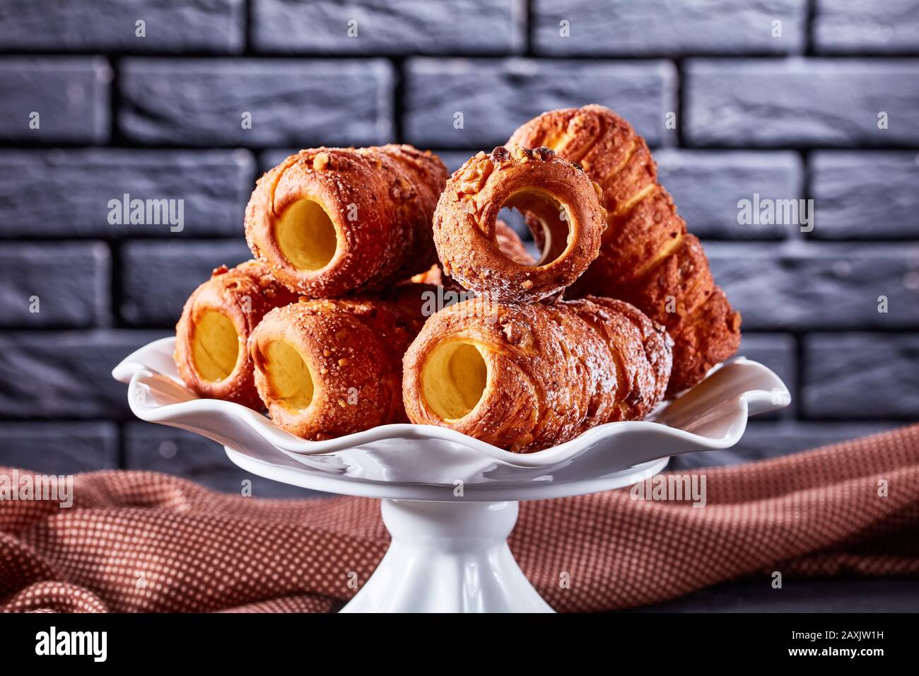 Hungarian Chimney Cake Or Kurtos Kalacs Sweet Rolled Dessert Served On A White Standing Plate On A Dark Concrete Background In Front Of A Black Bric Stock Photo Alamy Hungarian Chimney Cake Or Kurtos Kalacs Sweet Rolled Dessert Served On A White Standing Plate On A Dark Concrete Background In Front Of A Black Bric Stock Photo Alamy