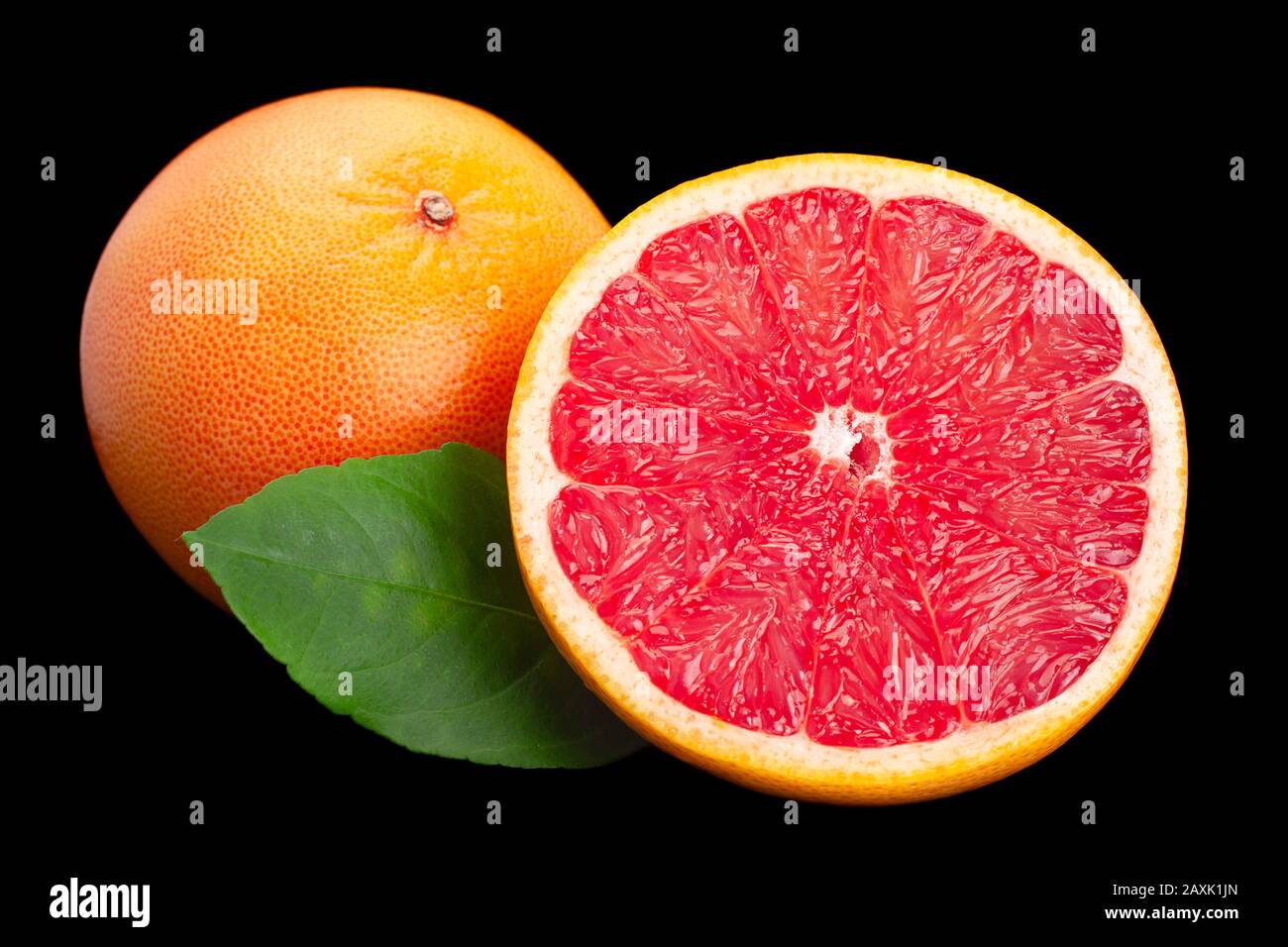 Grapefruit with leaf closeup isolated on black background Stock Photo