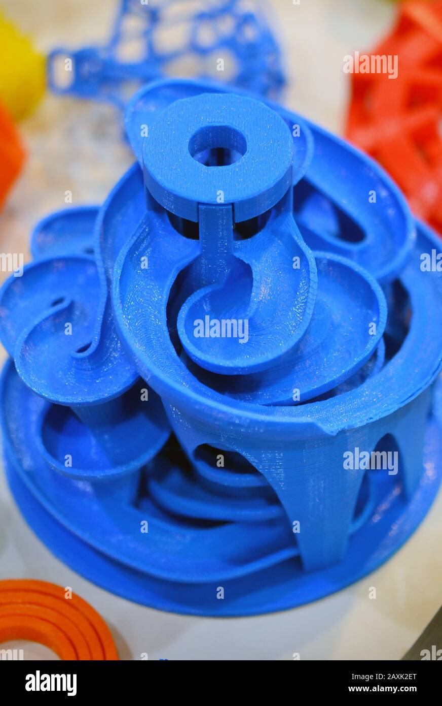 Objects printed by 3d printer. Bright colorful objects printed on a 3d printer on a table Stock Photo