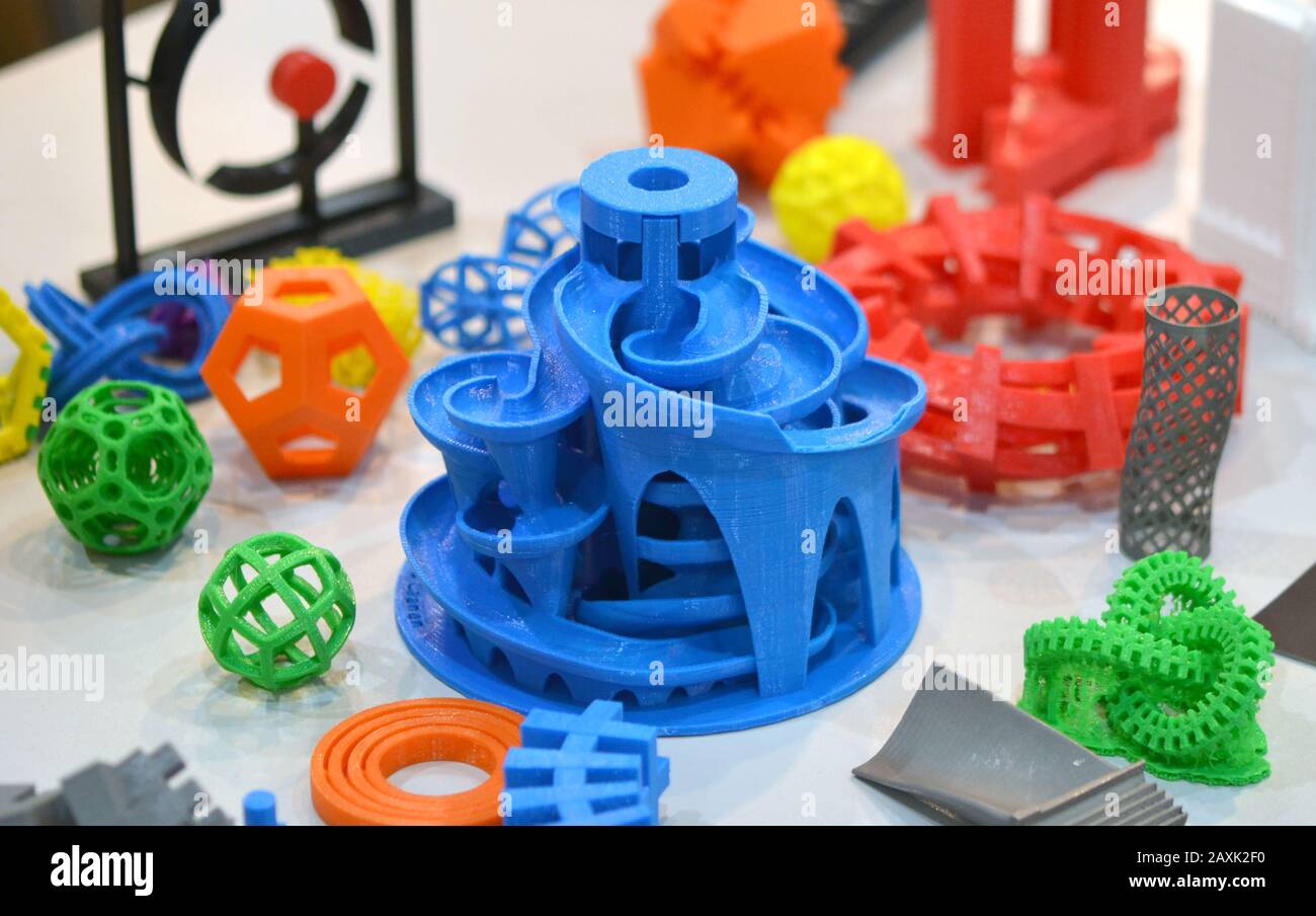 Models printed by 3d printer. Bright colorful objects printed on a 3d printer on a table Stock Photo