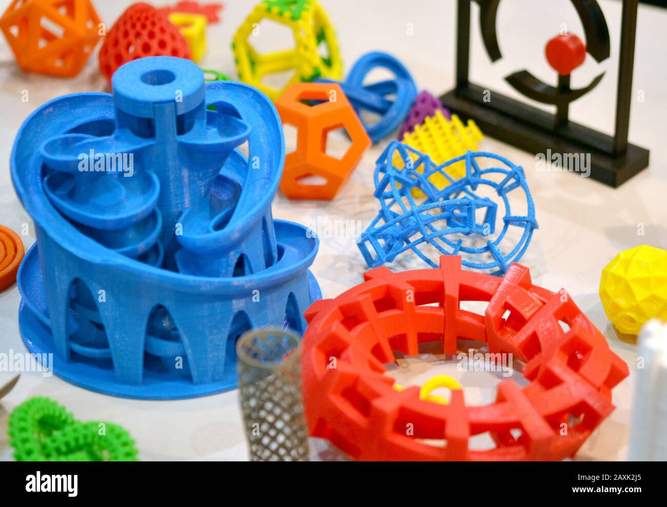 Objects printed by 3d printer. Bright colorful objects printed on a 3d printer on a table Stock Photo