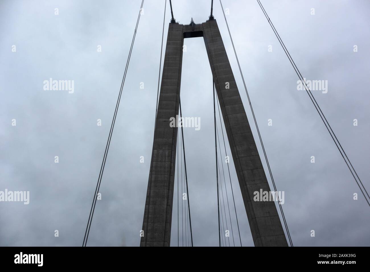 Bridge wire arch on dark dramatic sky scape heavy dark clouds. Swedish highroad northern architecture Stock Photo