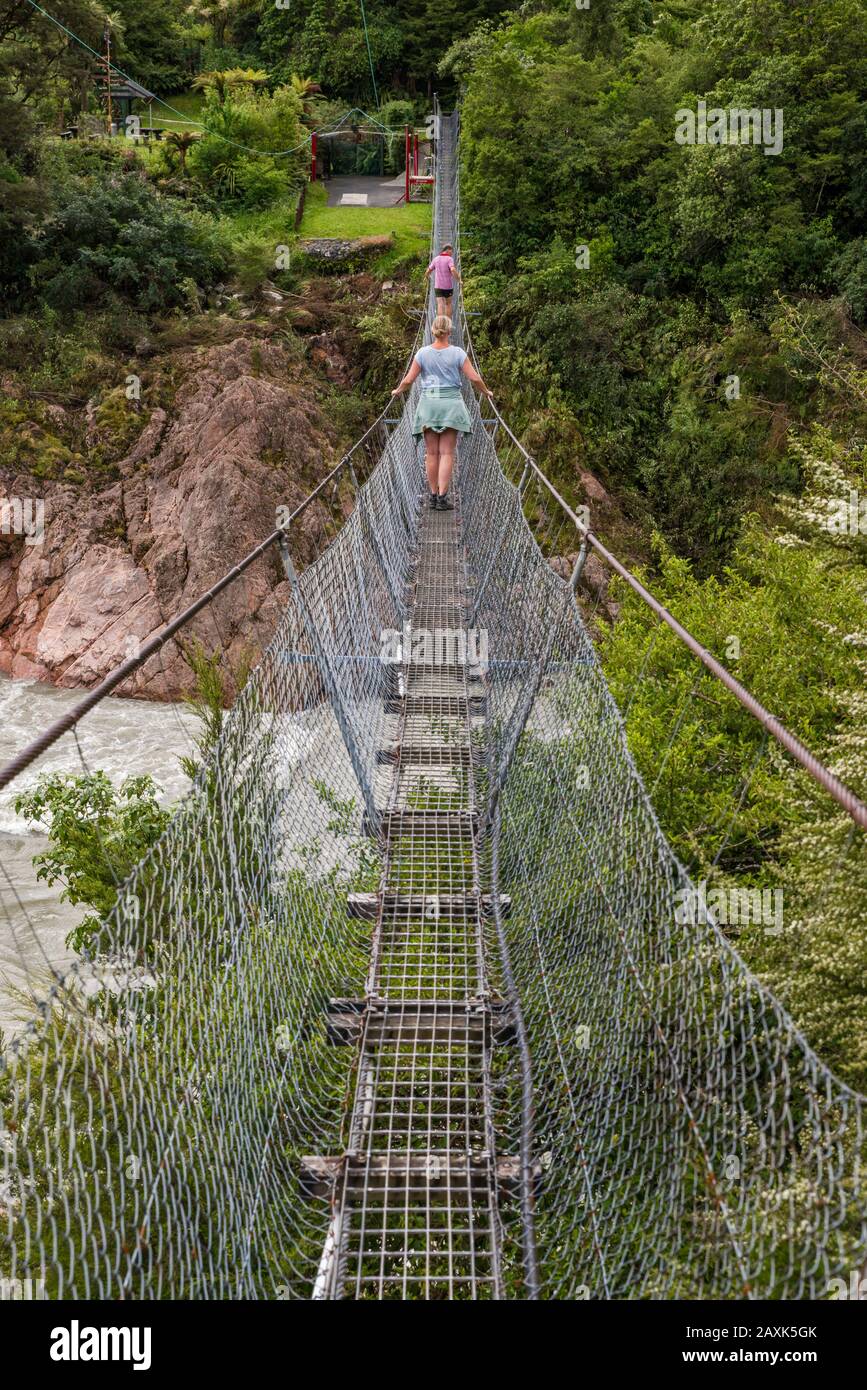 Buller Gorge Swing Bridge, pedestrian suspension bridge over Buller River, near Murchison, Tasman District, South Island, New Zealand Stock Photo