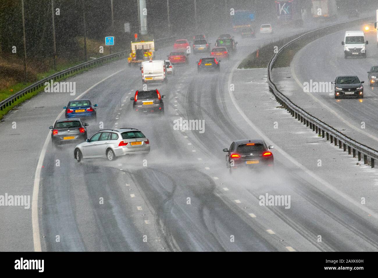 Motorway accident after driving in the middle of a hailstorm in Chorley, Lancashire.  UK Weather. Feb, 2020.  Motorist loses control of vehicle and crashes on M6 motorway after heavy microburst hailstorm makes for difficult driving conditions. The lucky BMW driver ended up hitting the Armco Crash Barrier, colliding on the hard shoulder and finished facing oncoming traffic. Credit; MediaWorldImages/AlamyLiveNews Stock Photo