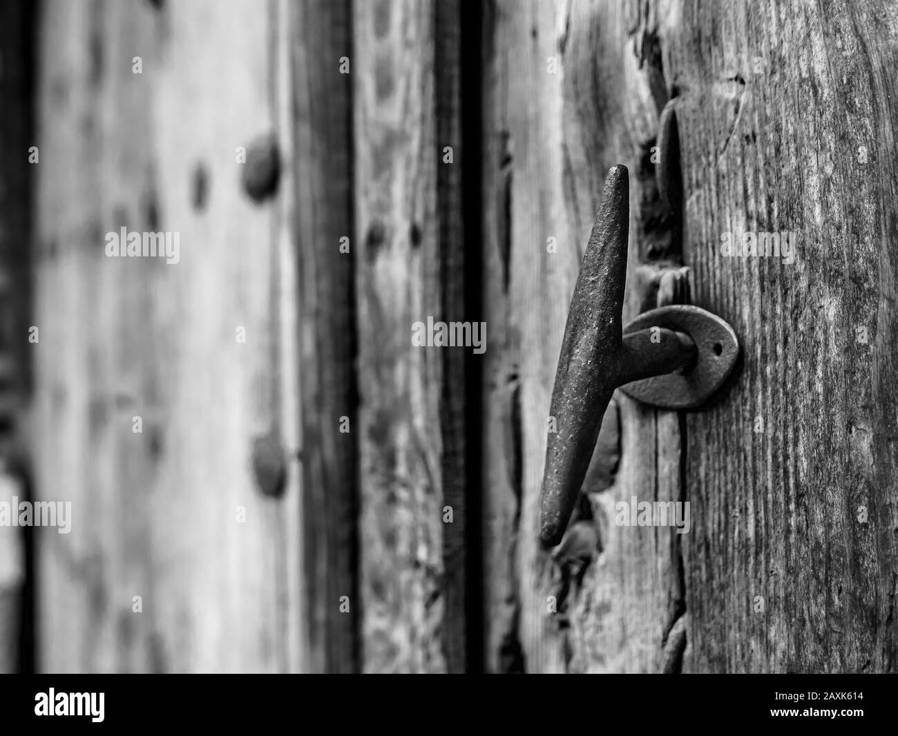 Detail of the doorknob or handle of an old vintage door - Black and White revealed. Talavera de la Reina Stock Photo