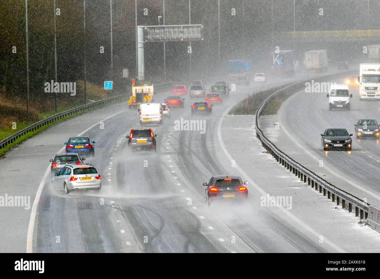 Motorway accident after driving in the middle of a hailstorm in Chorley, Lancashire.  UK Weather. Feb, 2020.  Motorists lose control of their vehicle and crash on M6 motorway after a heavy microburst hailstorm makes for difficult driving conditions. The lucky BMW driver hit the Armco Crash Barrier, collided on the hard shoulder and finished facing oncoming traffic. Stock Photo