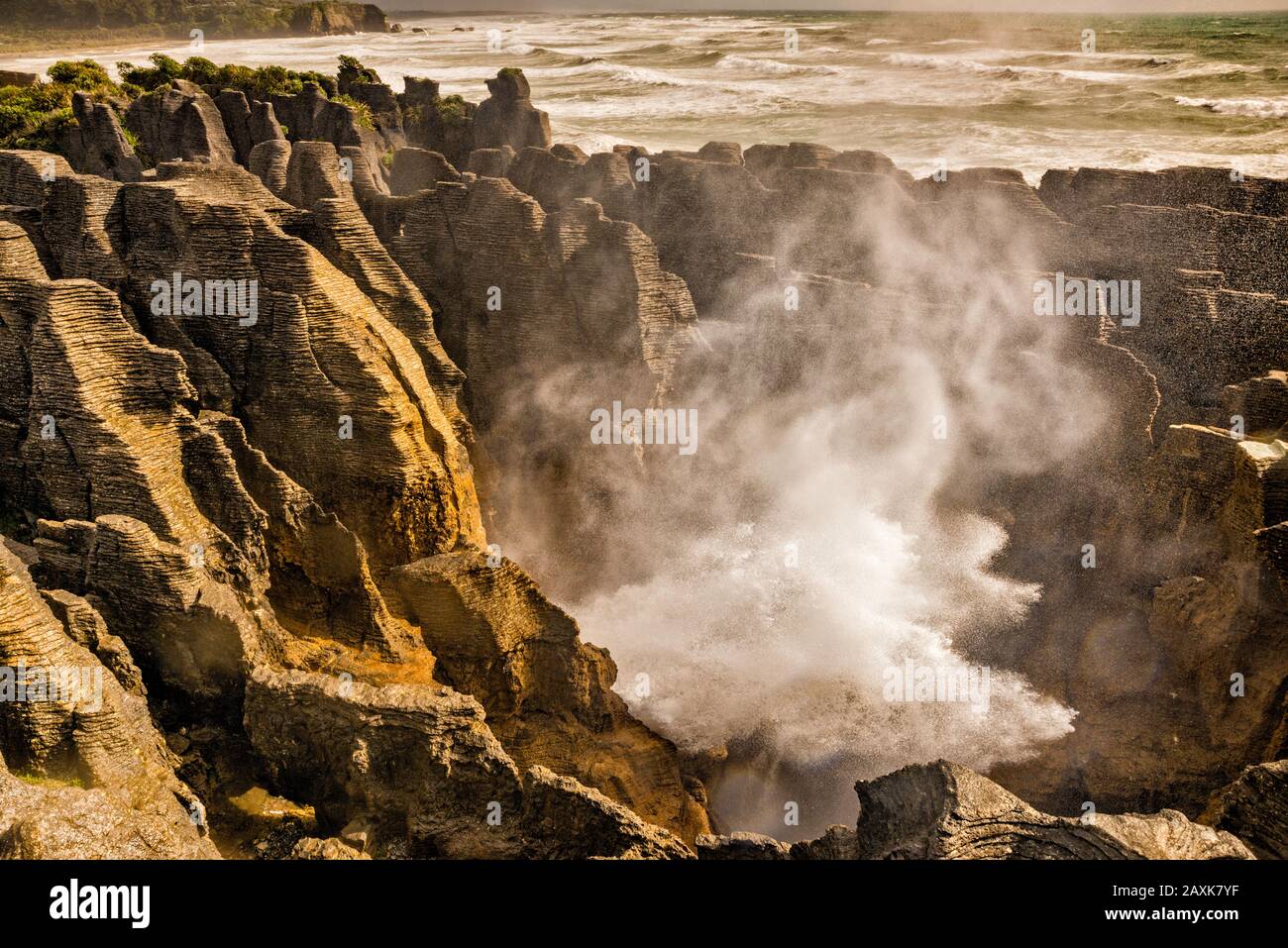 Surf at Pancake Rocks at high tide, Dolomite Point, Paparoa National Park, near village of Punakaiki, West Coast Region, South Island, New Zealand Stock Photo