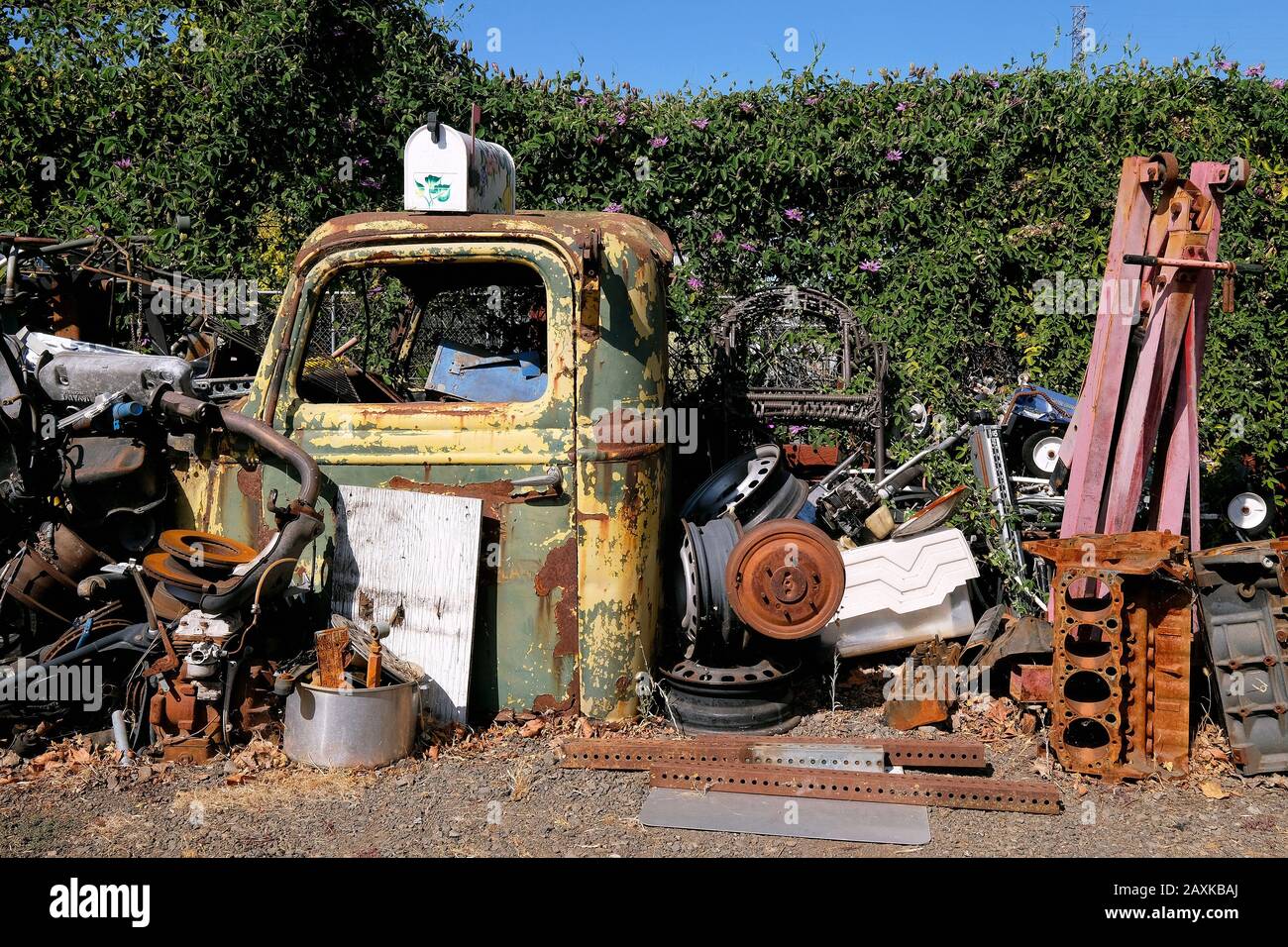 Parts of old pickup trucks in front of a garage, Petaluma, California