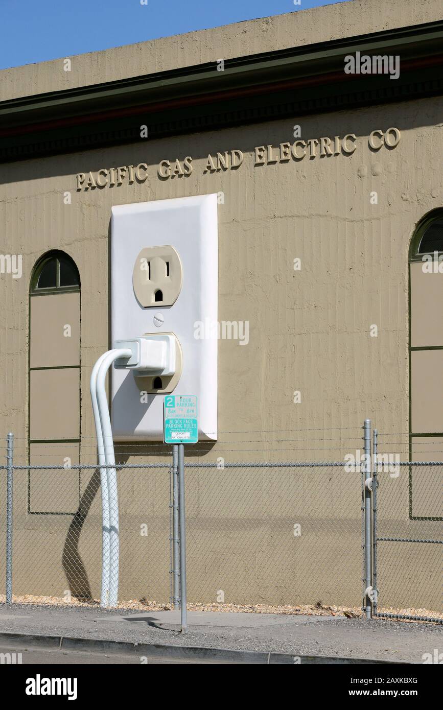 Huge socket with plug at a building of the Pacific Gas And Electric Company, Petaluma, California, USA Stock Photo