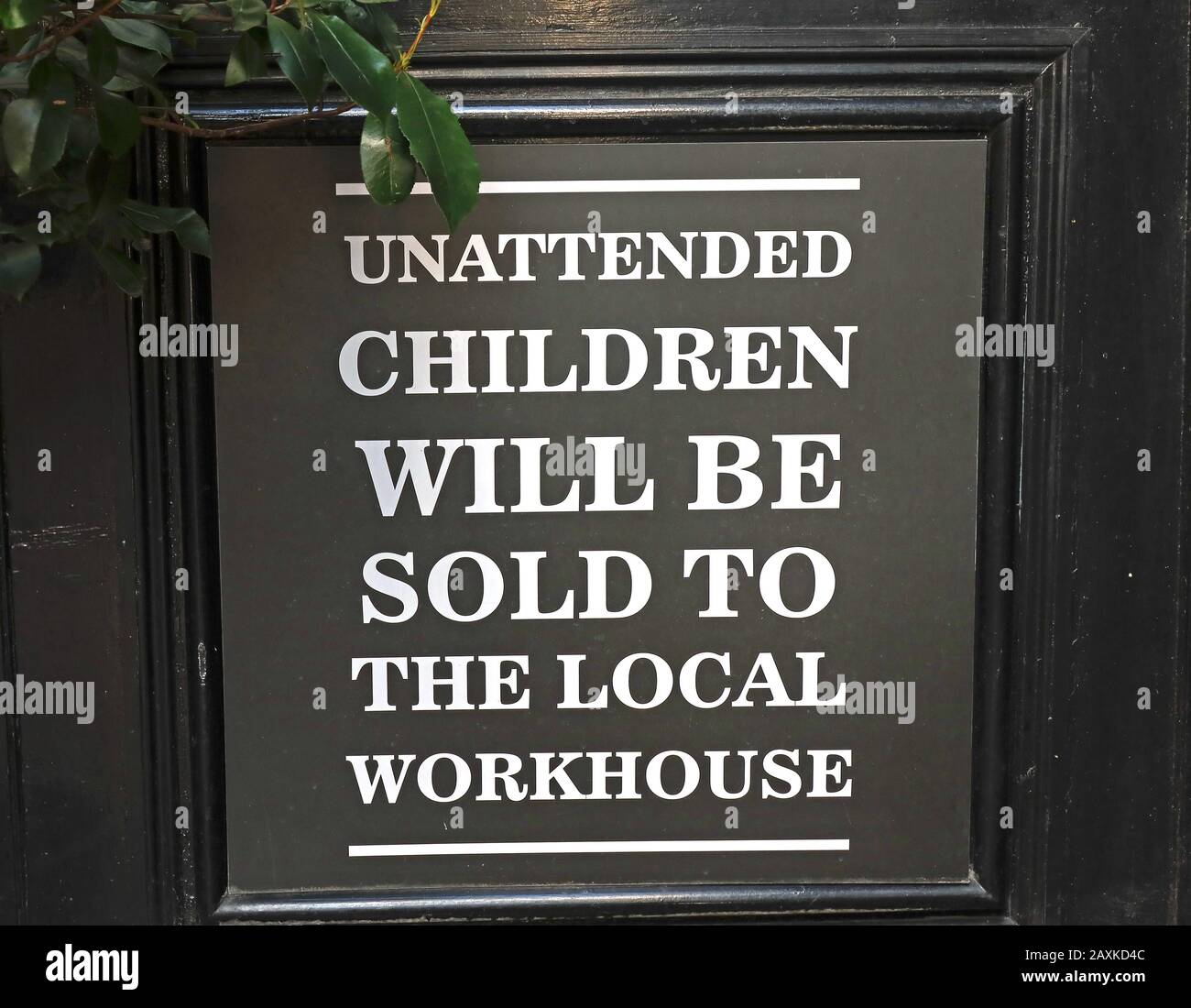 sign,Unattended Children,will be sold,to the local workhouse, Victorian pub sign Stock Photo