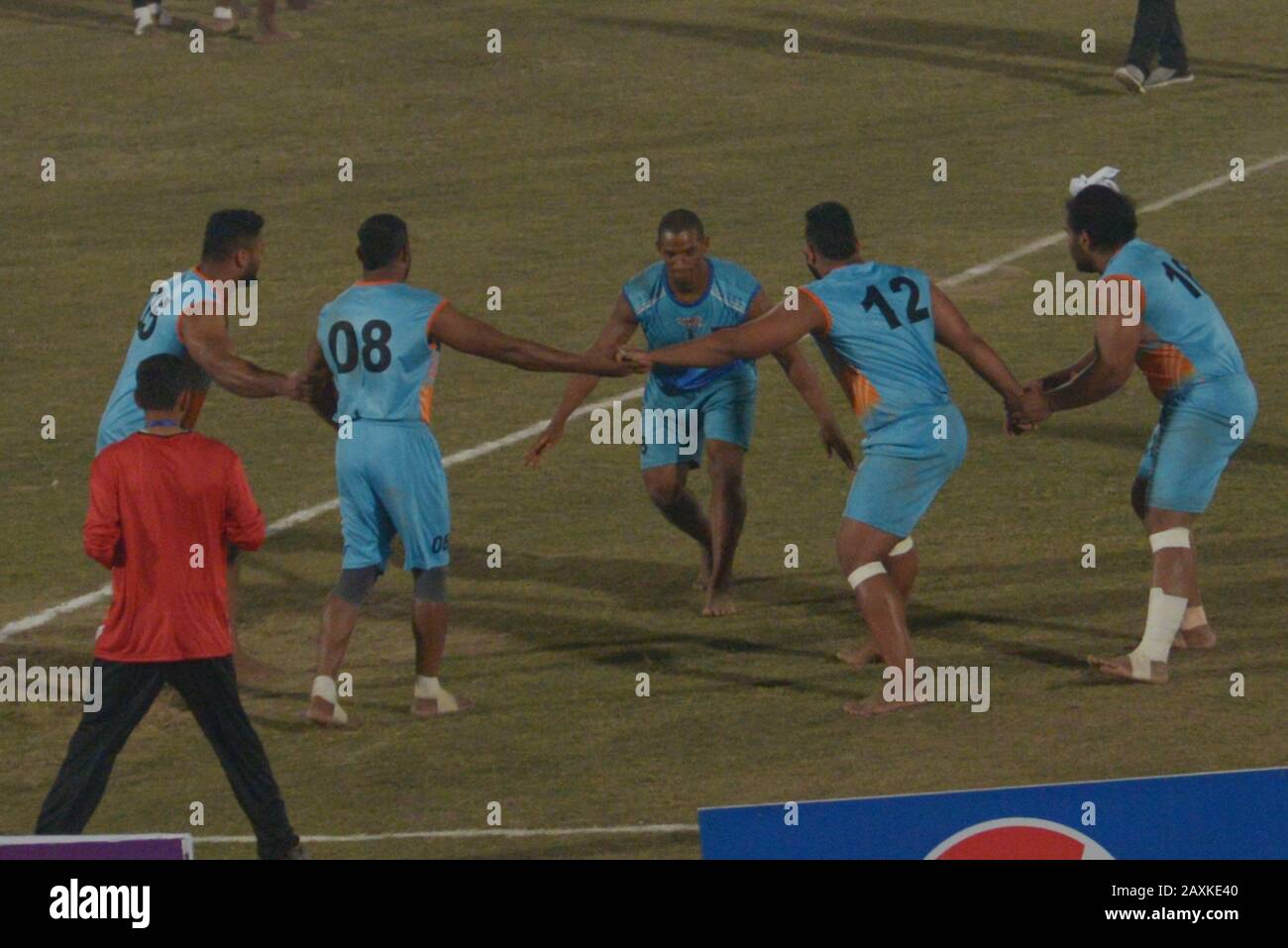 Kabaddi players seem in action during the match playing between India vs Sierra Leone, as Indian Kabaddi team win by 18-45 during Kabaddi World Cup 2020 at Punjab Stadium Lahore. Kabaddi World Cup 2020 begins in Pakistan. All is set for the 'Kabaddi World Cup 2020' being hosted in three cities Lahore, Faisalabad and Gujrat from February 09 to 16 February. respectively. The event is jointly organized by Punjab government, Sports Board Punjab (SBP) and Pakistan Kabaddi Federation (PKF). (Photo by Rana Sajid Hussain/Pacific Press) Stock Photo
