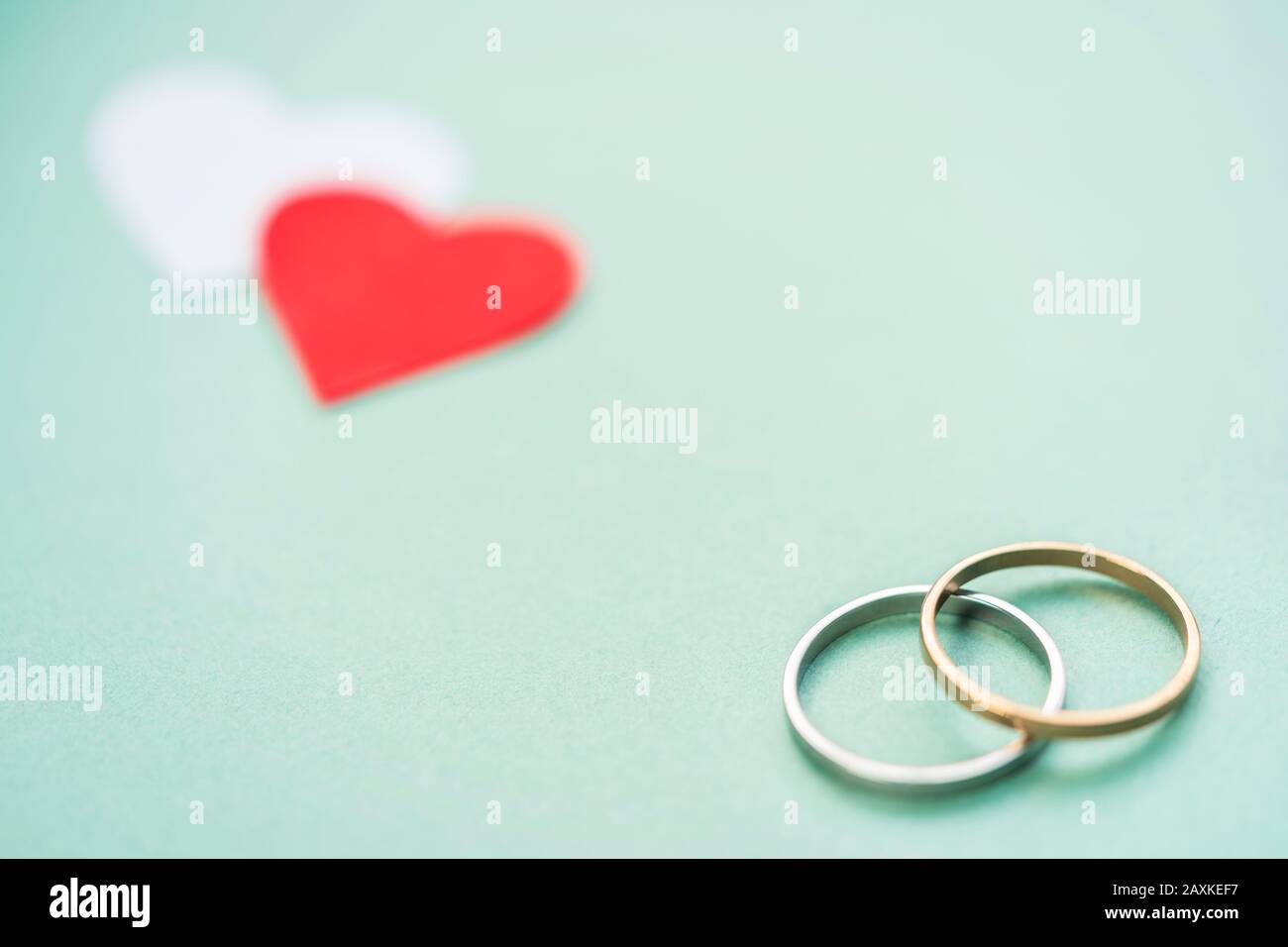 Romantic wedding rings with hearts still life wallpaper with copy space.  Concept for valentine's day, engagement, couple love, anniversary, card,  cove Stock Photo - Alamy