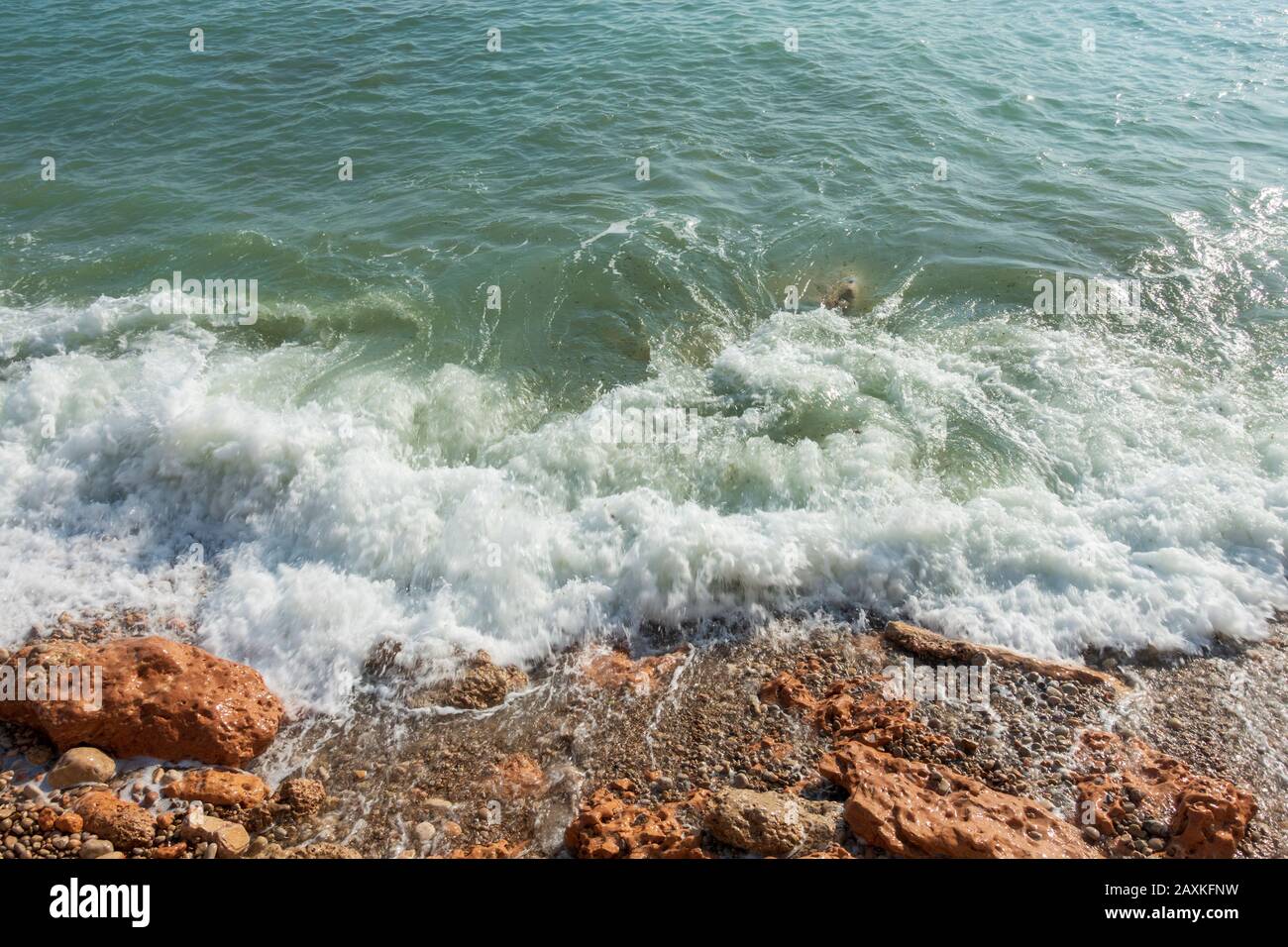 Clear sea waves reaching sandy hi-res stock photography and images - Alamy