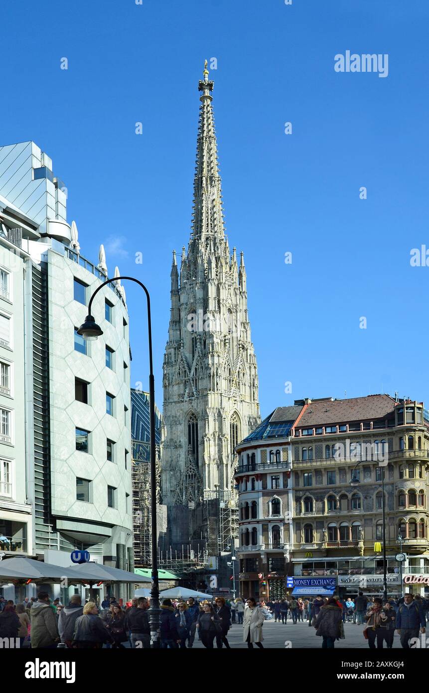 Vienna, Austria - March 27th 2016: Unidentified crowd of people on Stephansplatz with Haas Haus and Stephansdom cathedral in the center of the city Stock Photo